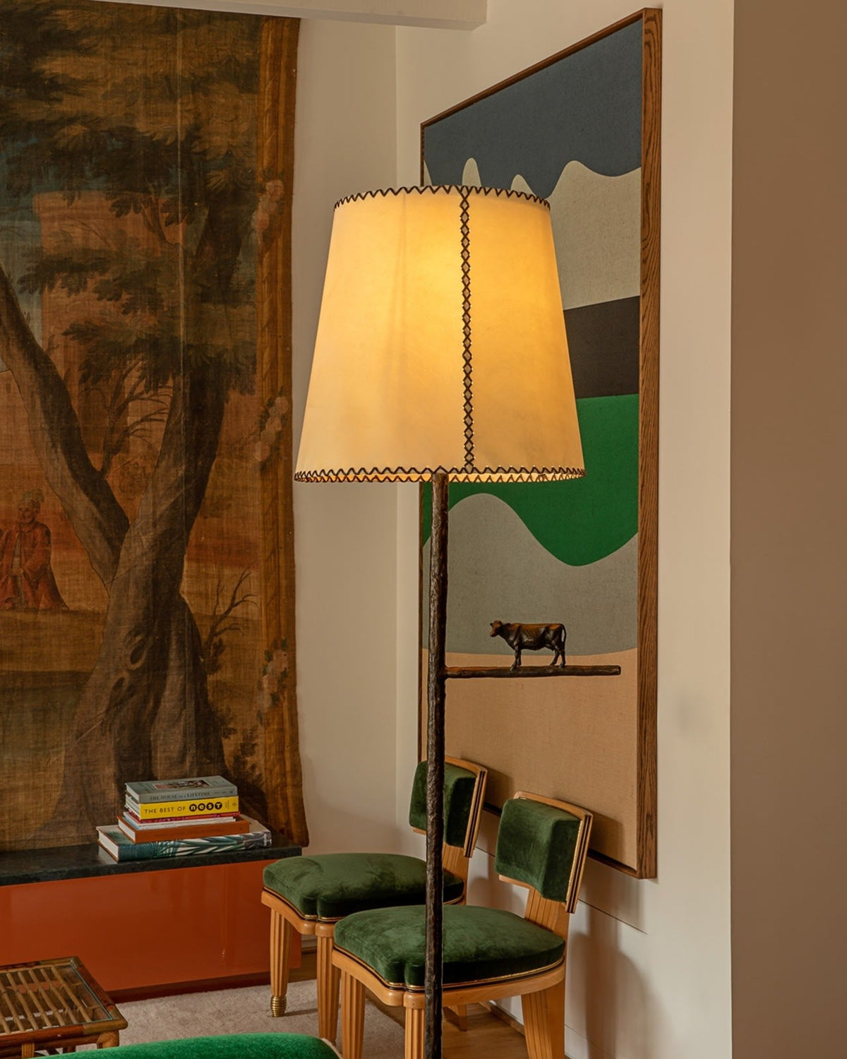 Farm Light Floor Lamp — positioned beside green chairs in living room