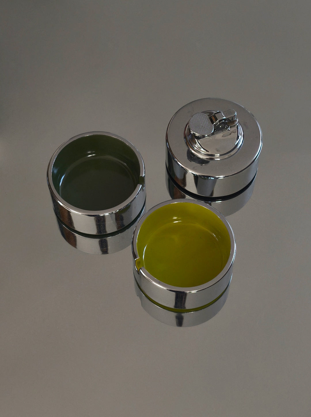 Vintage Ashtray and Lighter by Isamu Kenmochi, 60's — close-up of shiny metal and colored interiors
