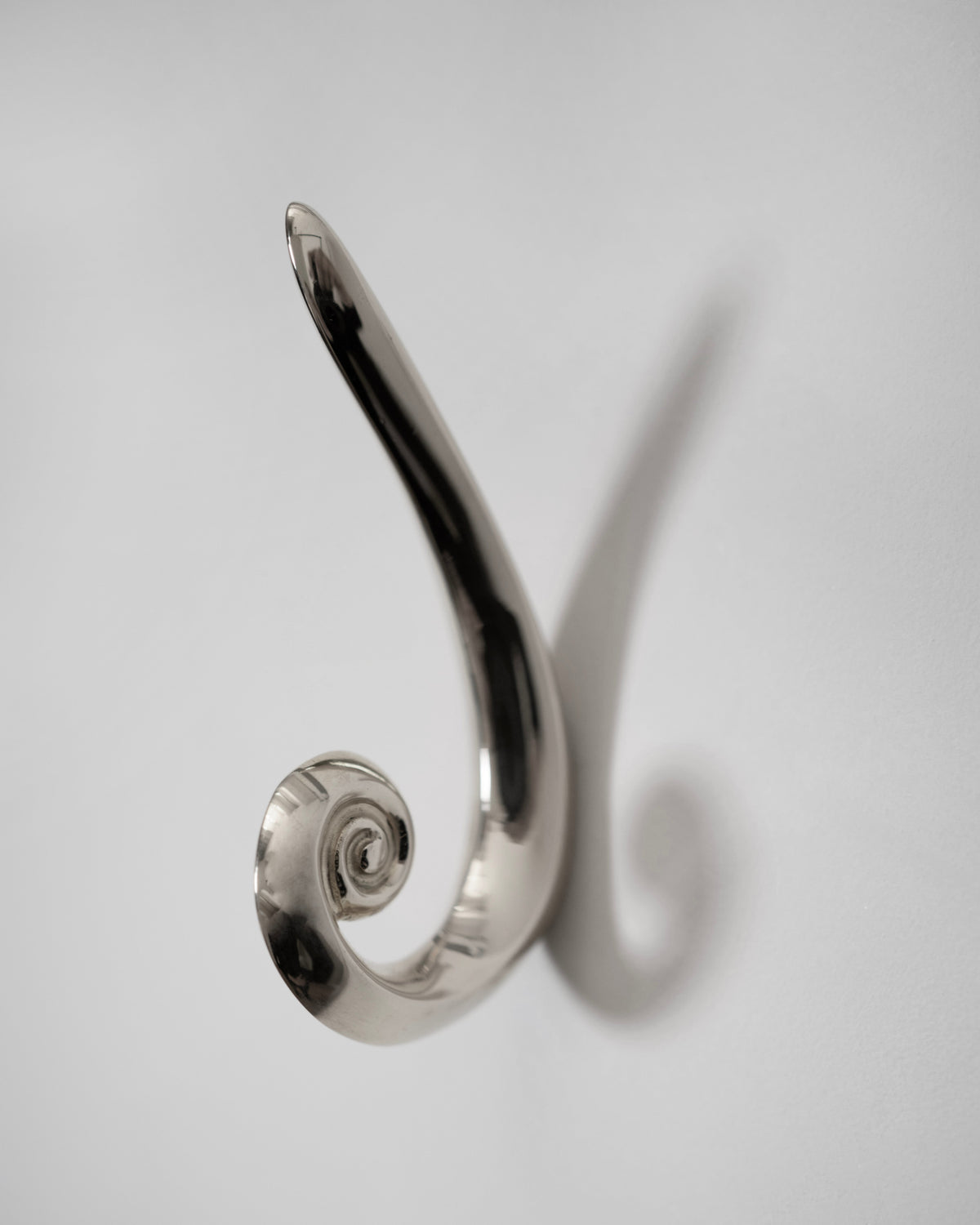 Noelle Hook - Titanium — back view against white wall