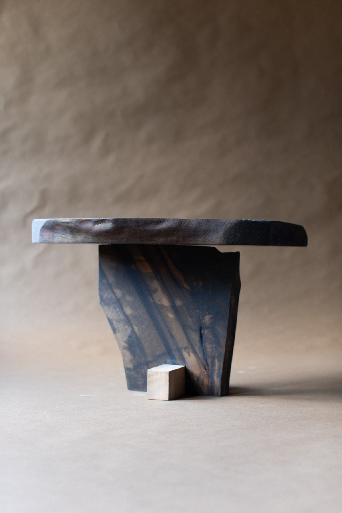 Qawha side table sculptural wood base with geometric cube detail