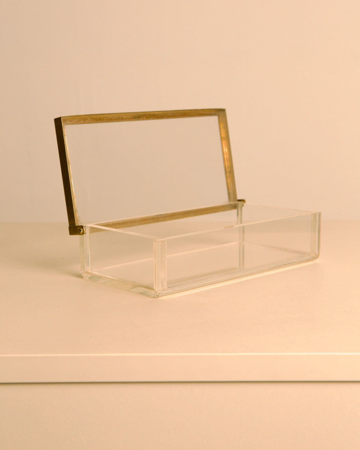 talian rectangular plexiglass box with metal trim, 1970s — close-up