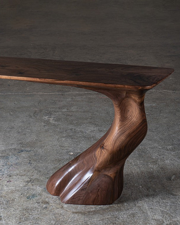 Frolic Wall Mounted Console in Walnut wood Natural Stain — side angle showing curved wooden base