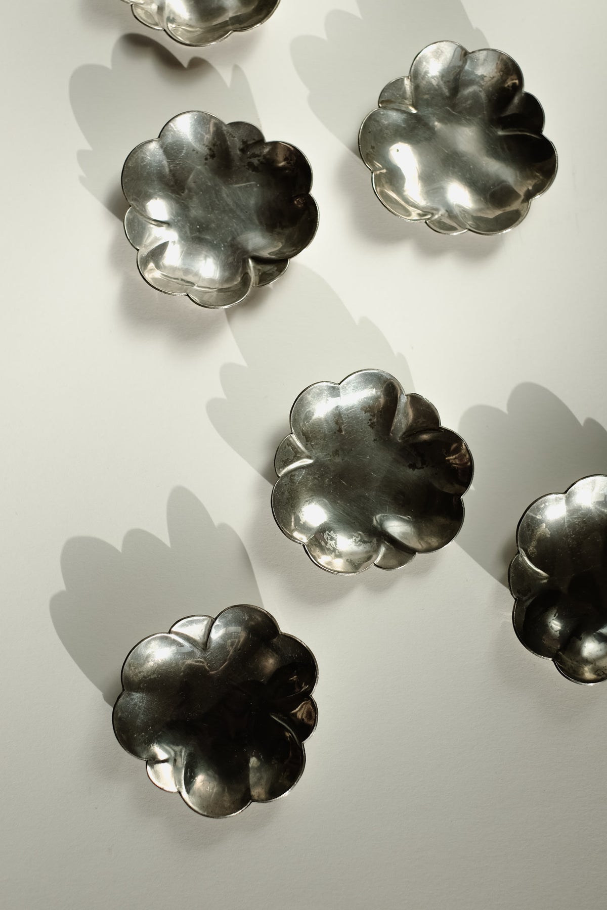 Set of 6 Small Dishes — overhead view of silver metal dishes