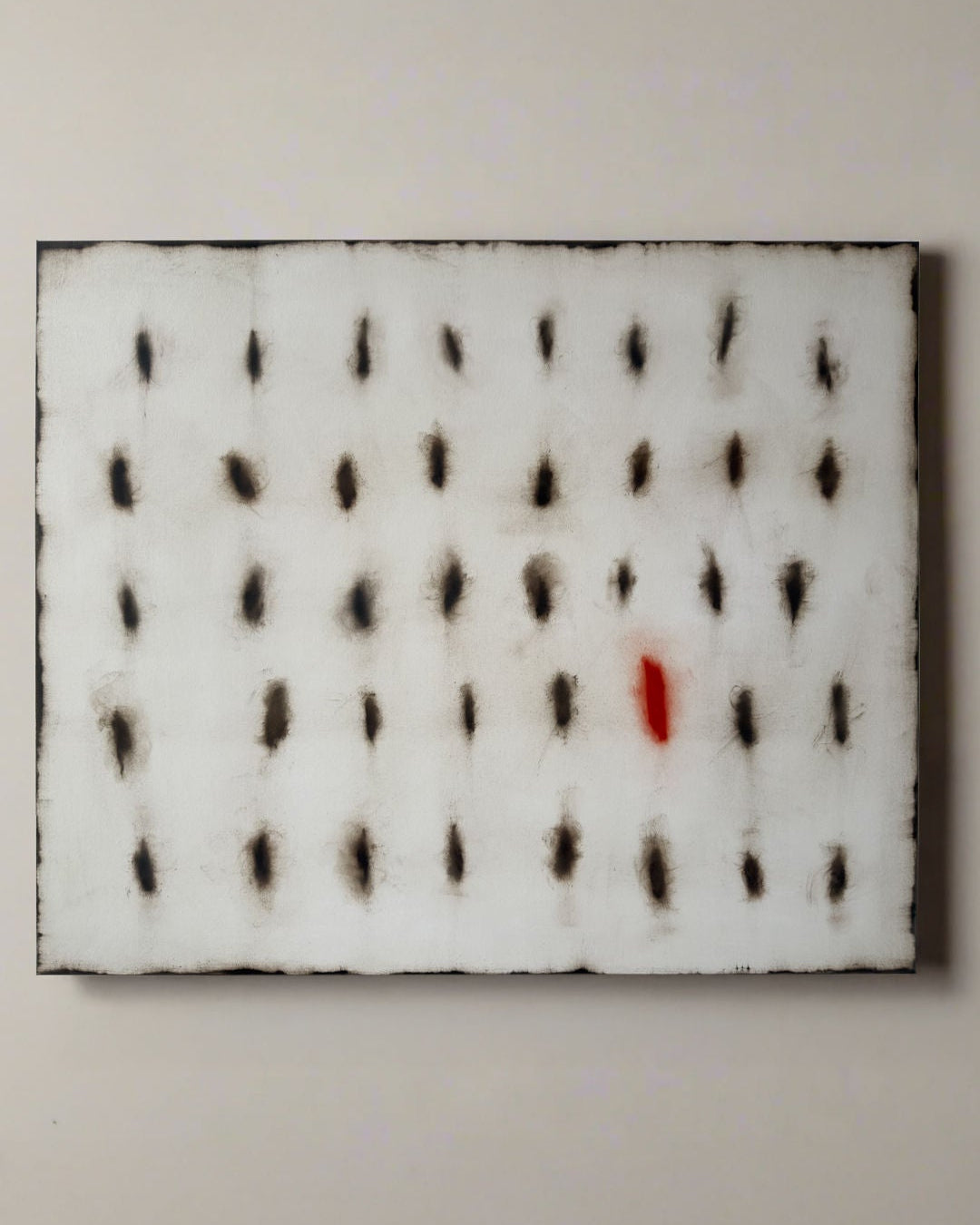 Abstract oil painting with grid pattern of dark oval marks and single red accent