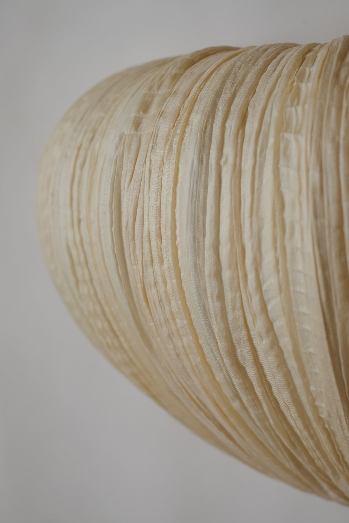 Maro Gold Silk Wall Lamp — Ayala Serfaty — close-up of textured silk shade