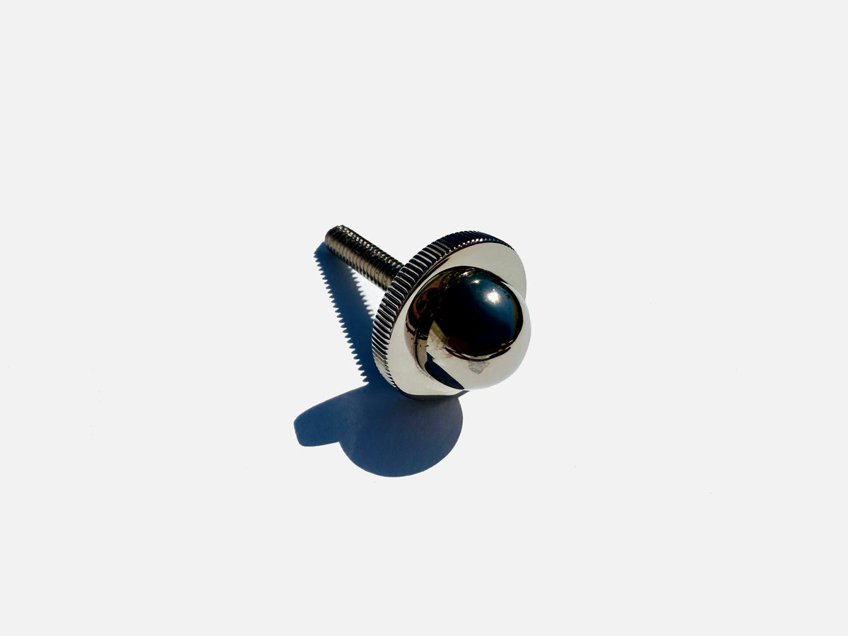 Selene wall sconce brass detail with dark blue glass sphere