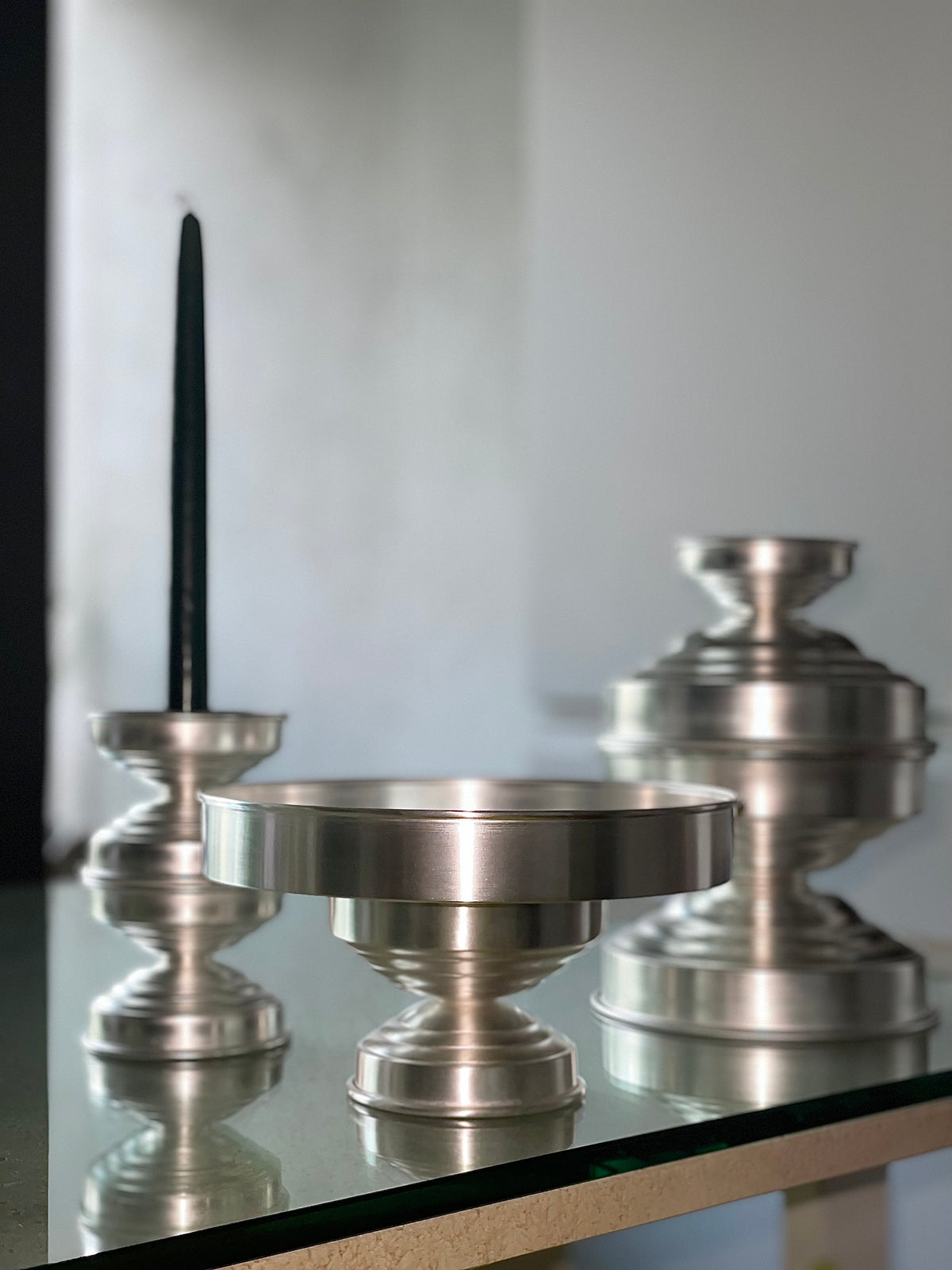 Contemporary Bowl Silver Plated — top view on glass table with candle