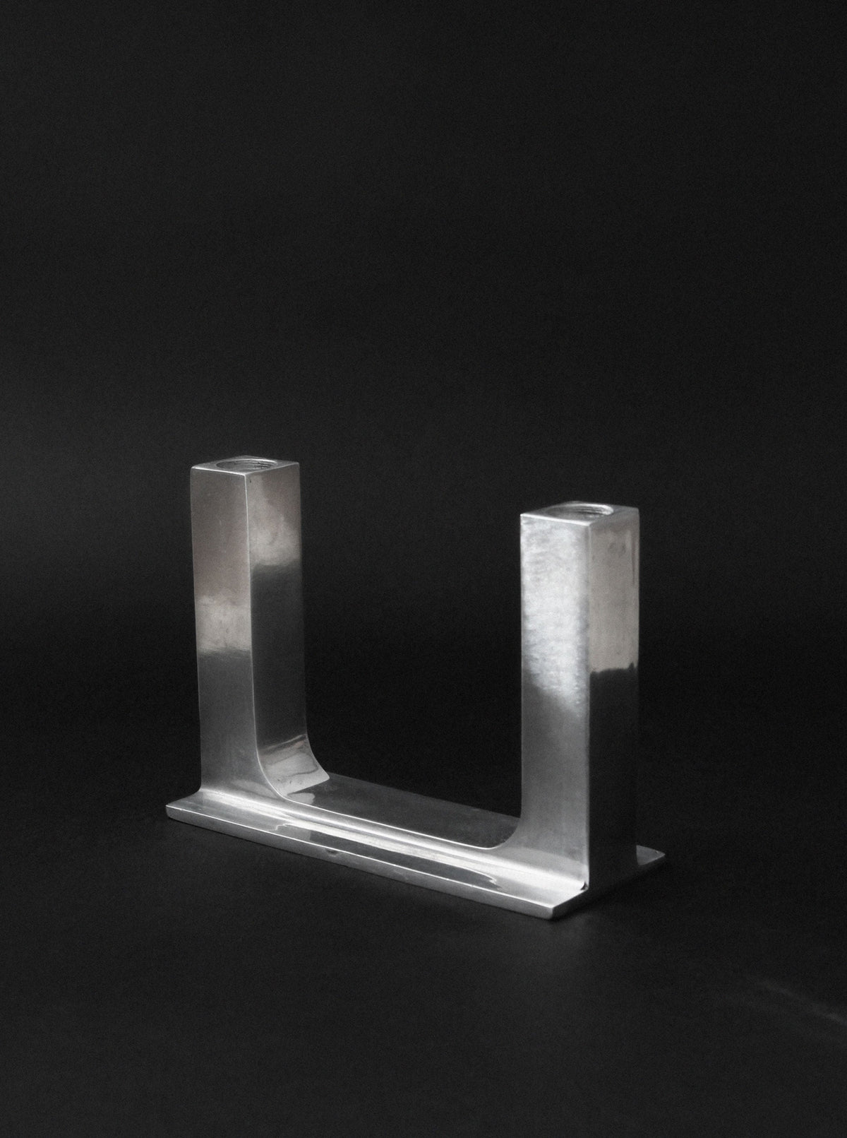 Modern brutalist aluminum candle holder U-shaped design detail