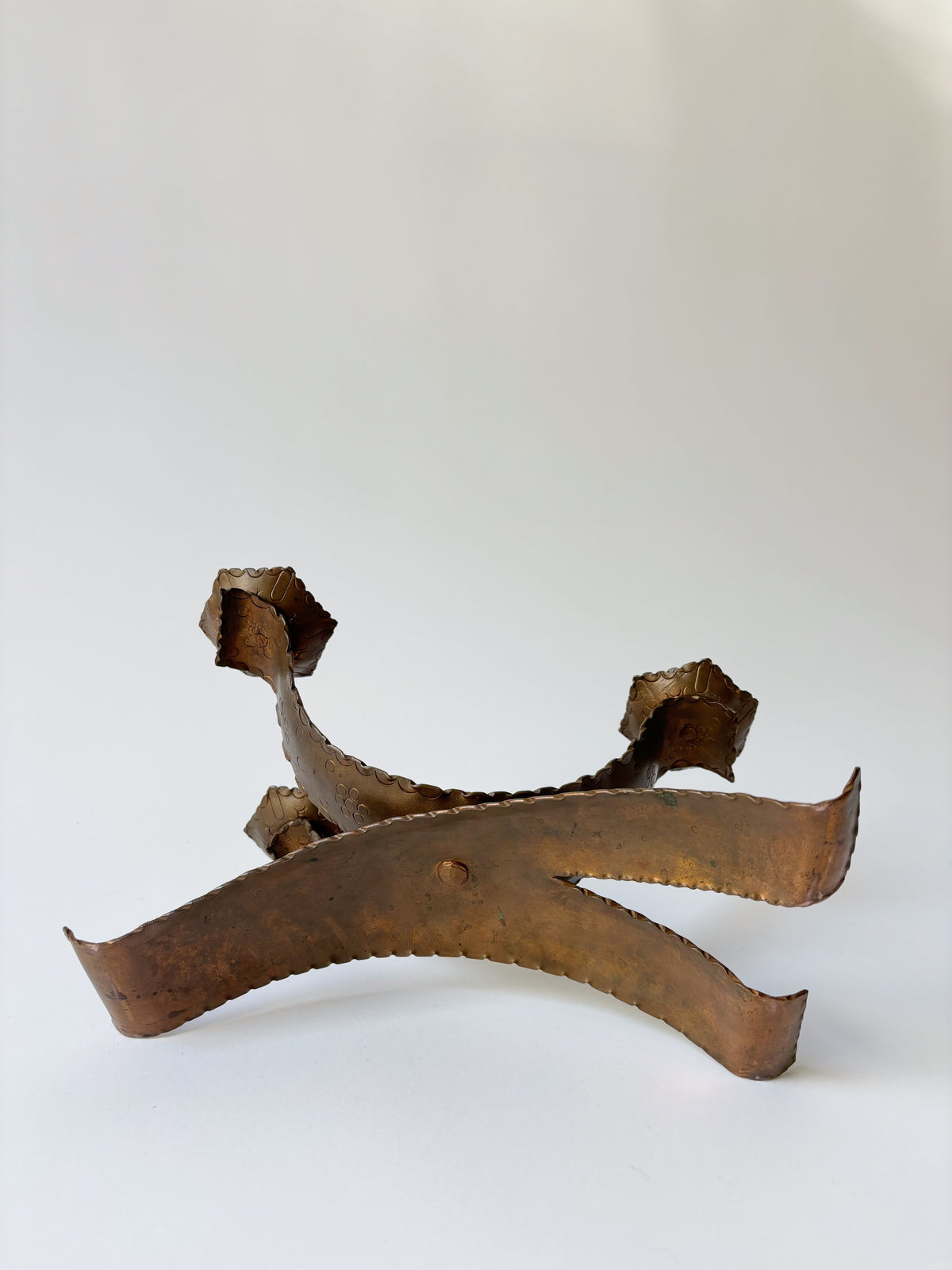 Large Metal Curved Artisan Candlestick, Poland — angled view on white background
