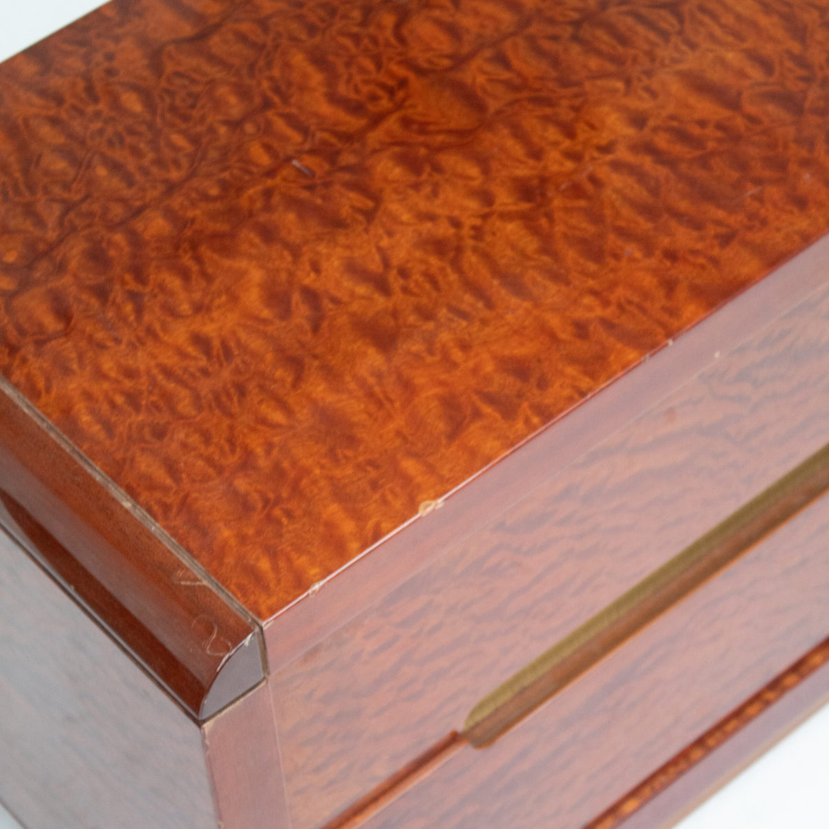Italian Nightstands in Wood and Brass — close-up of warm wood grain texture