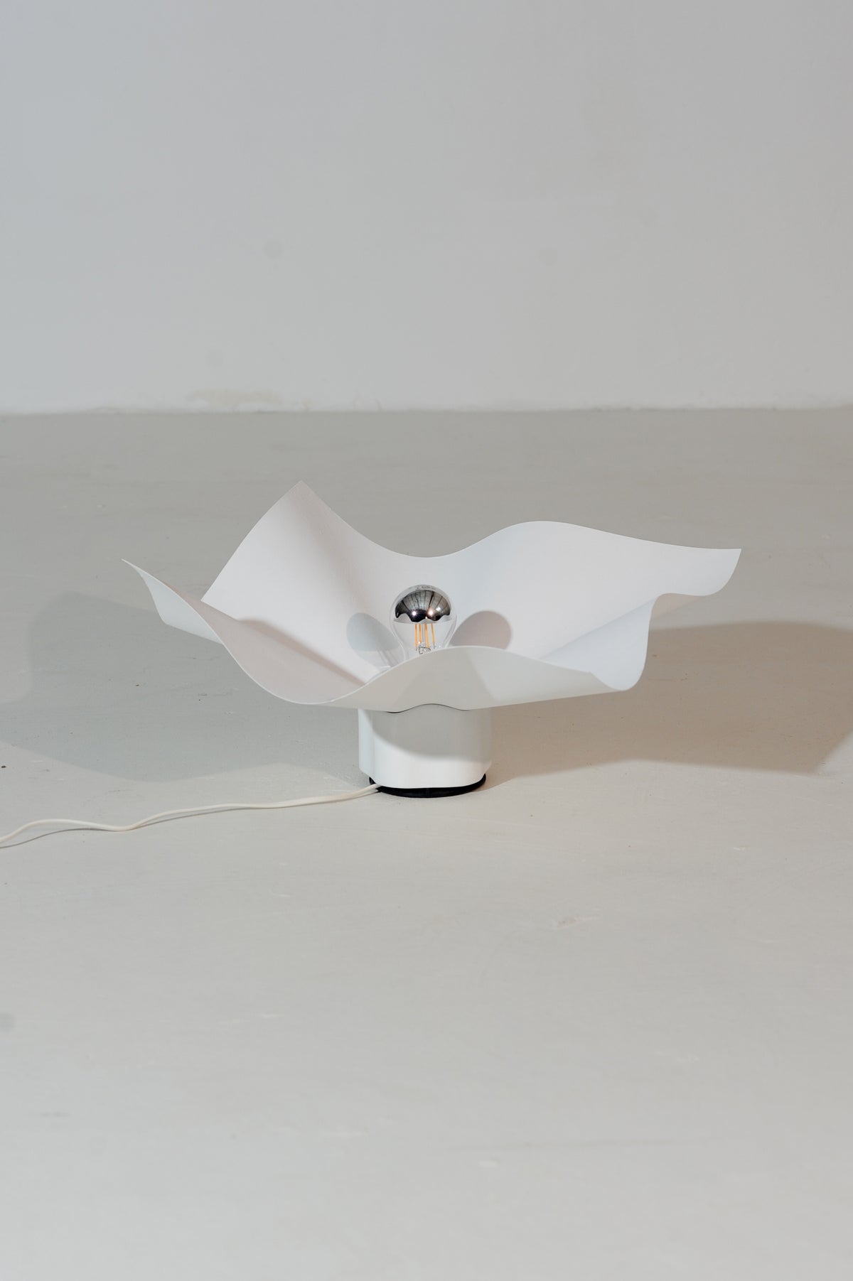 Mario Bellini Area Lamp, Italy 1974 — angled view on white floor