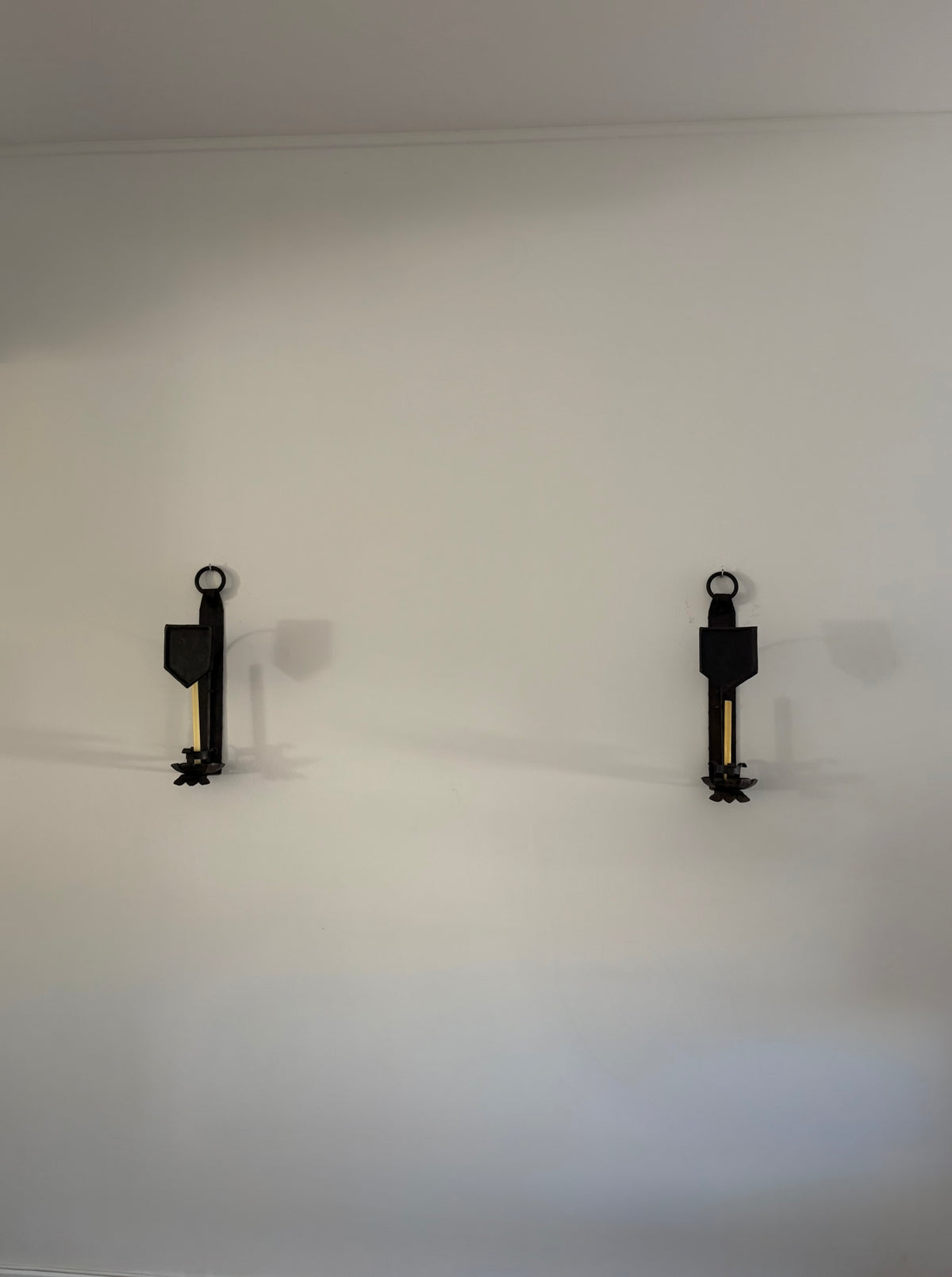 Pair of Hand-Forged Wall Candleholders, Trás-os-Montes, Portugal, c. 1900–1910 — lifestyle setting