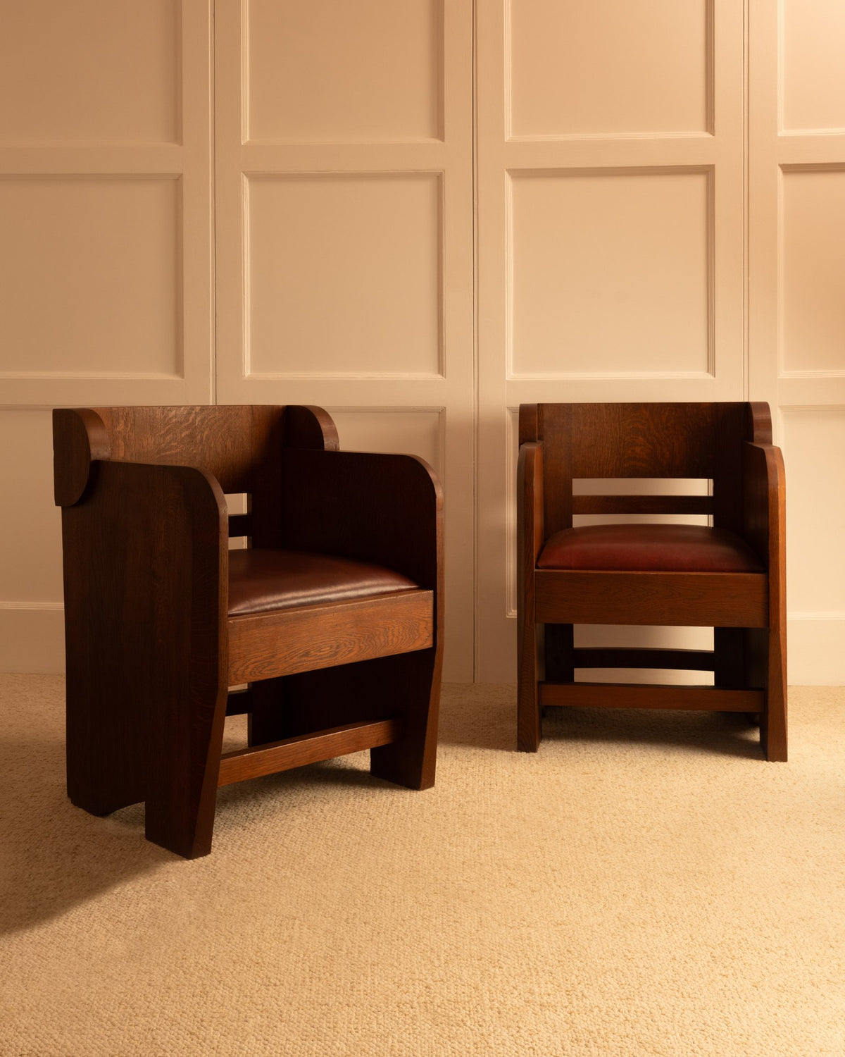 Two dark oak anthroposophical armchairs with curved backs