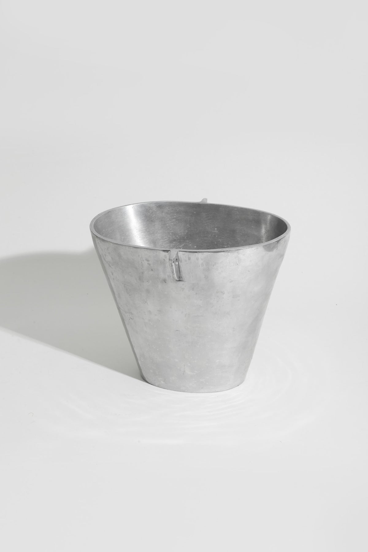 Form Sculpture Chrome Vase — top view of metallic surface
