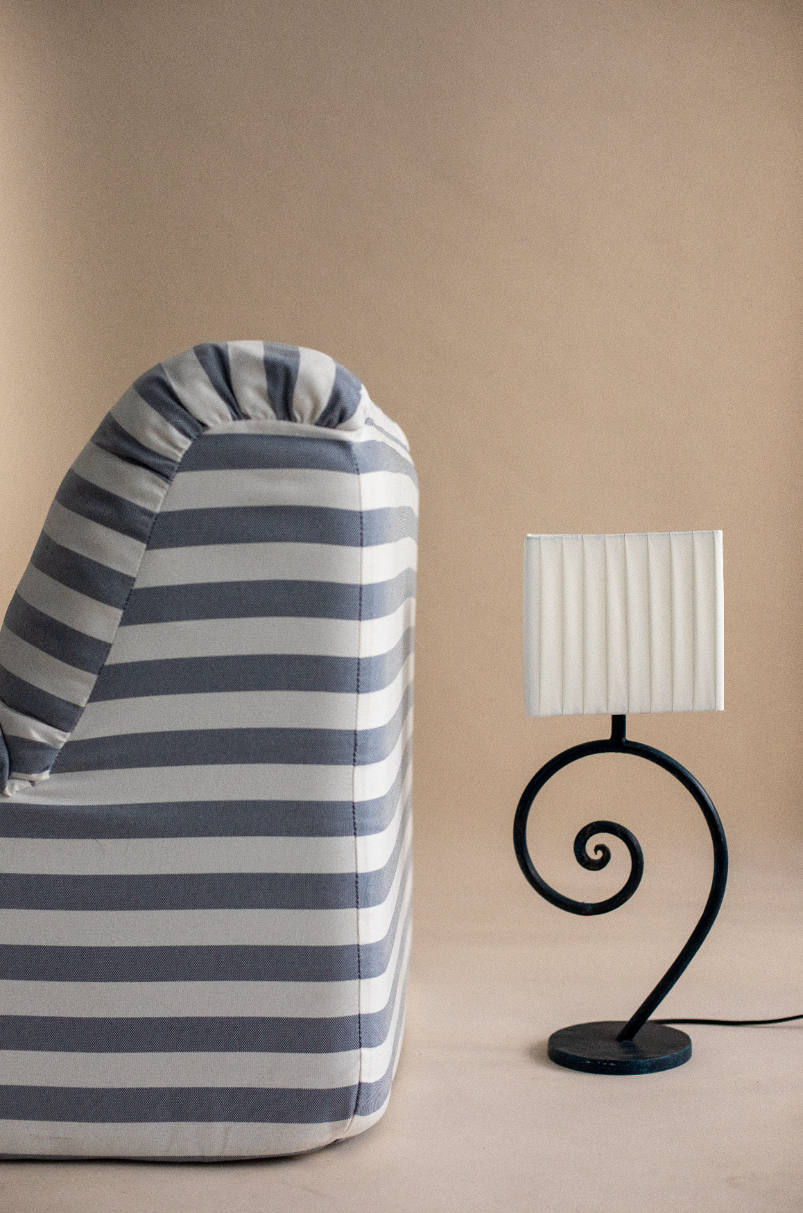 Nazaré table lamp with sculptural spiral base and pleated shade