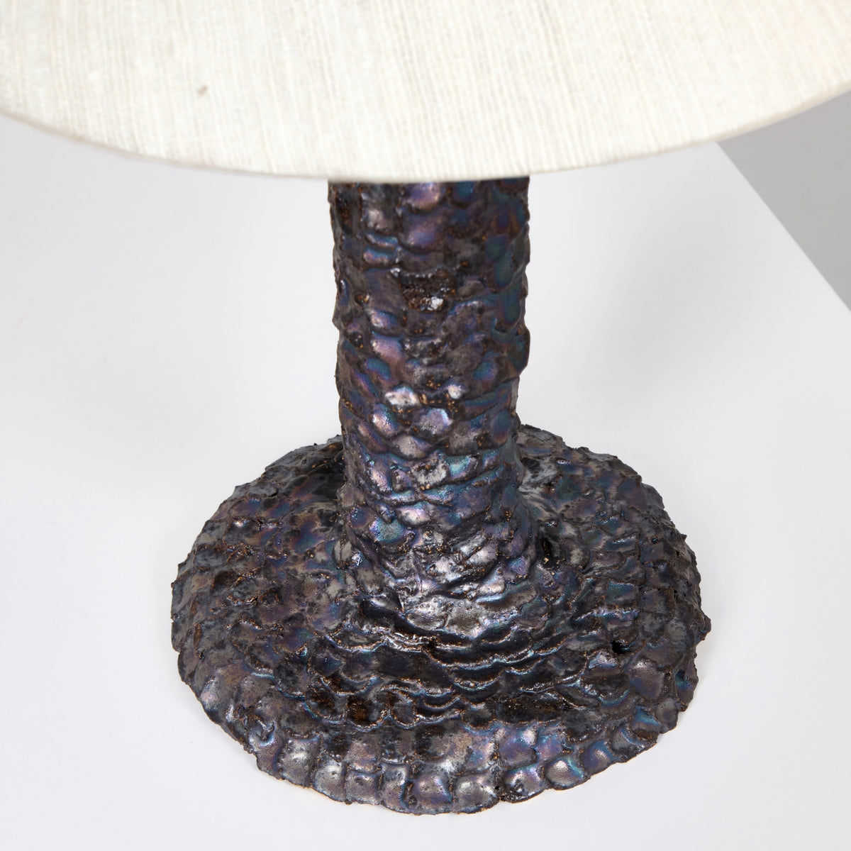 Casa Bedside Light — close-up of textured dark metal base
