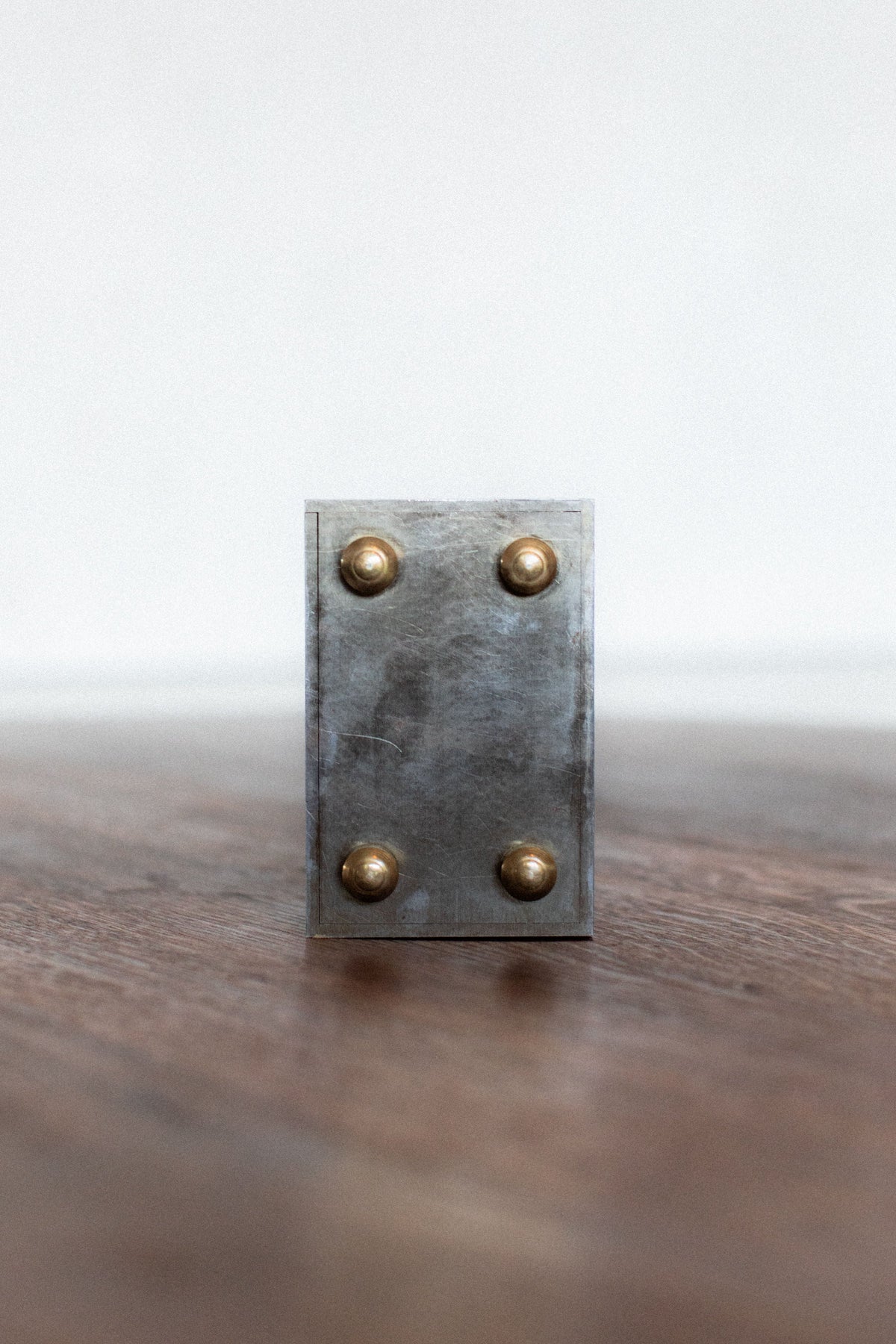 Industrial zinc metal box with brass rivets detail view