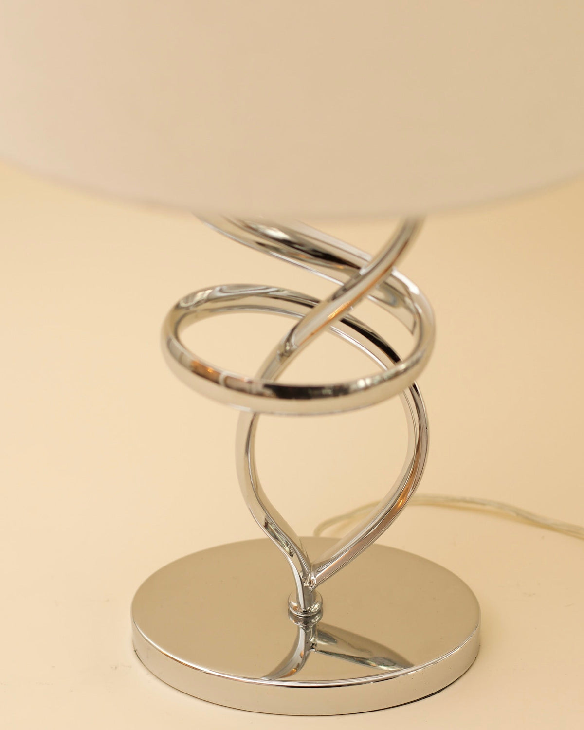 MIES Table Lamp — close-up of chrome spiral base