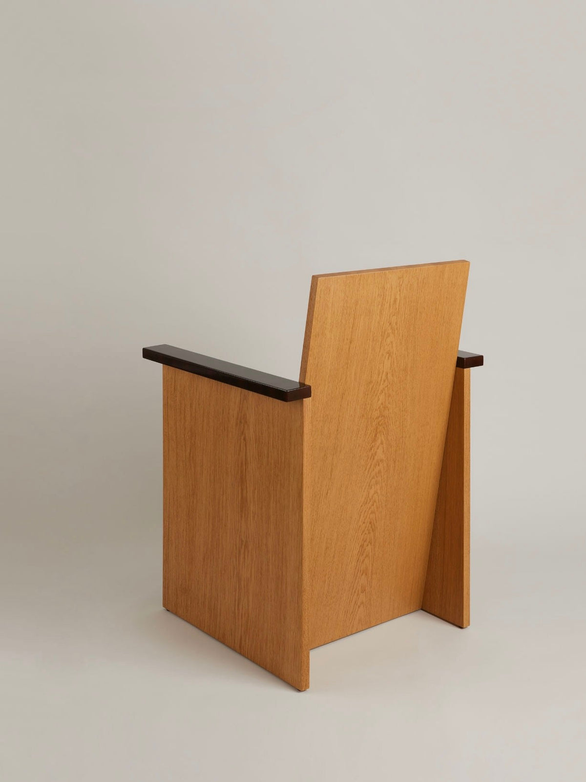 Le Parfait Armchair — side angle showing oak and dark wood details