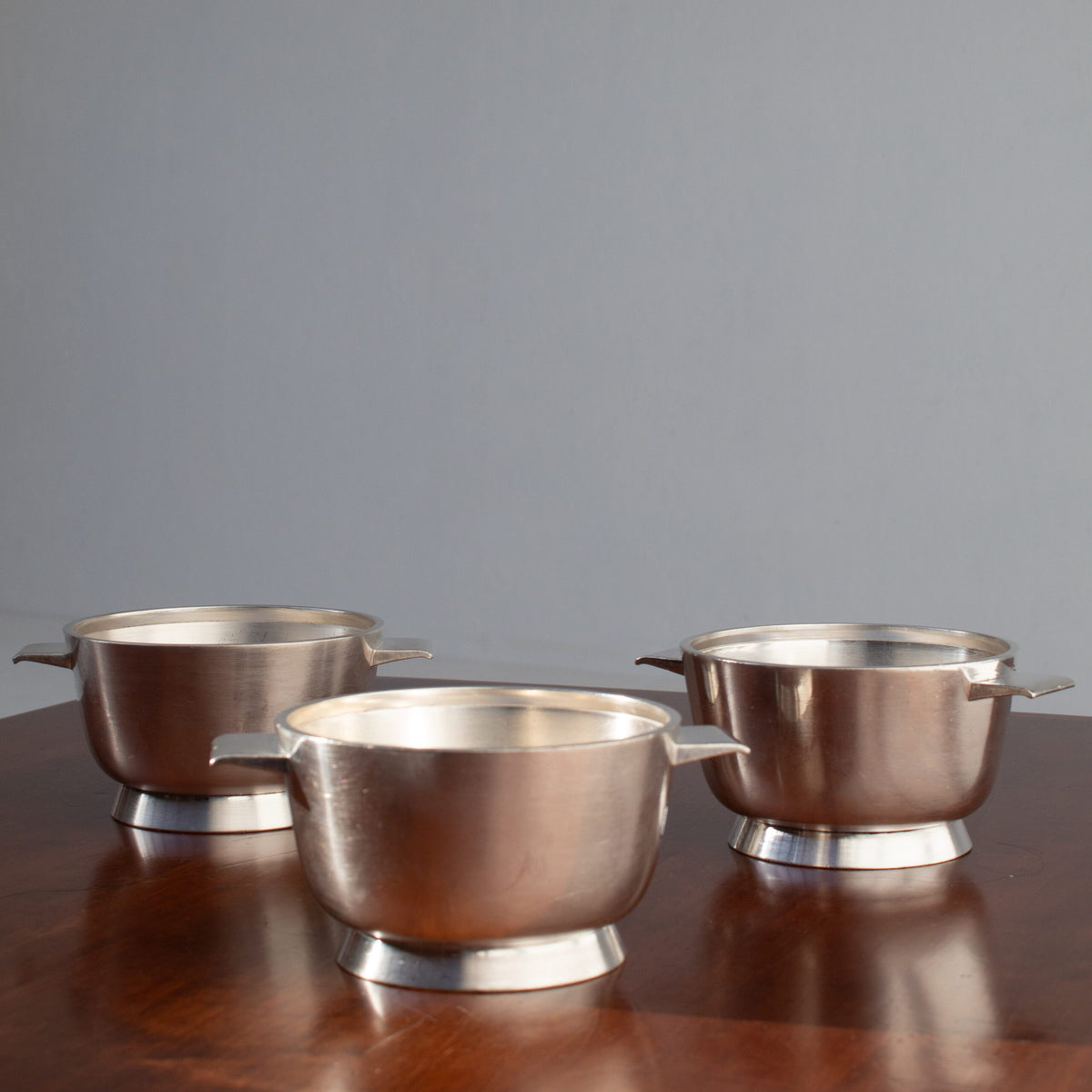 Arthur Krupp Milano Silver Plated Bowls Set — side angle on wooden table