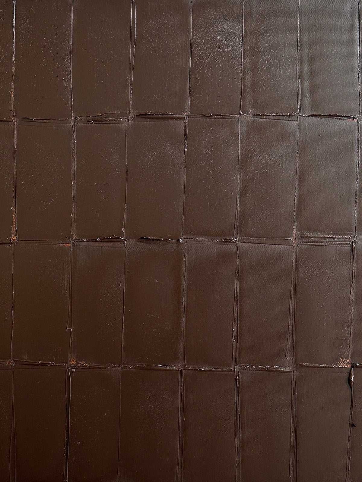 Abstract burnt umber painting with textured grid pattern detail