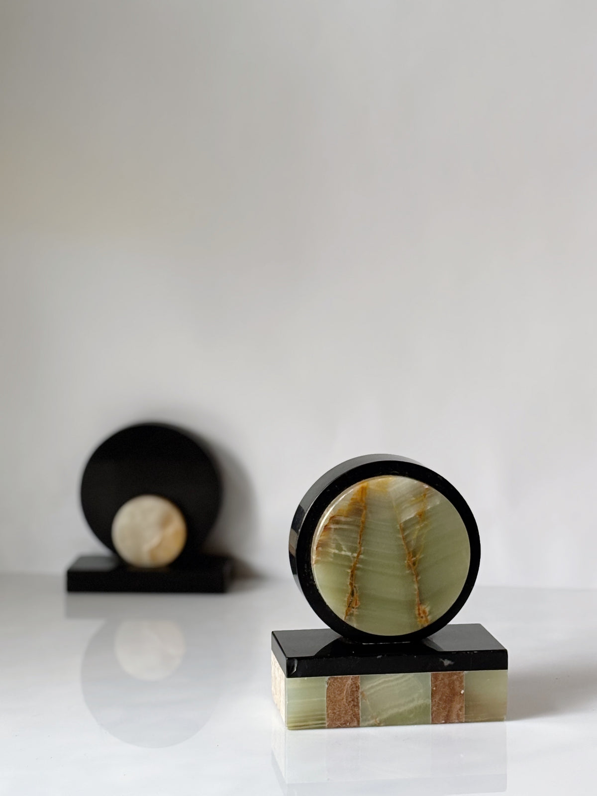 Art Deco Marble & Onyx Bookends, Germany — top view showing circular onyx and rectangular marble base