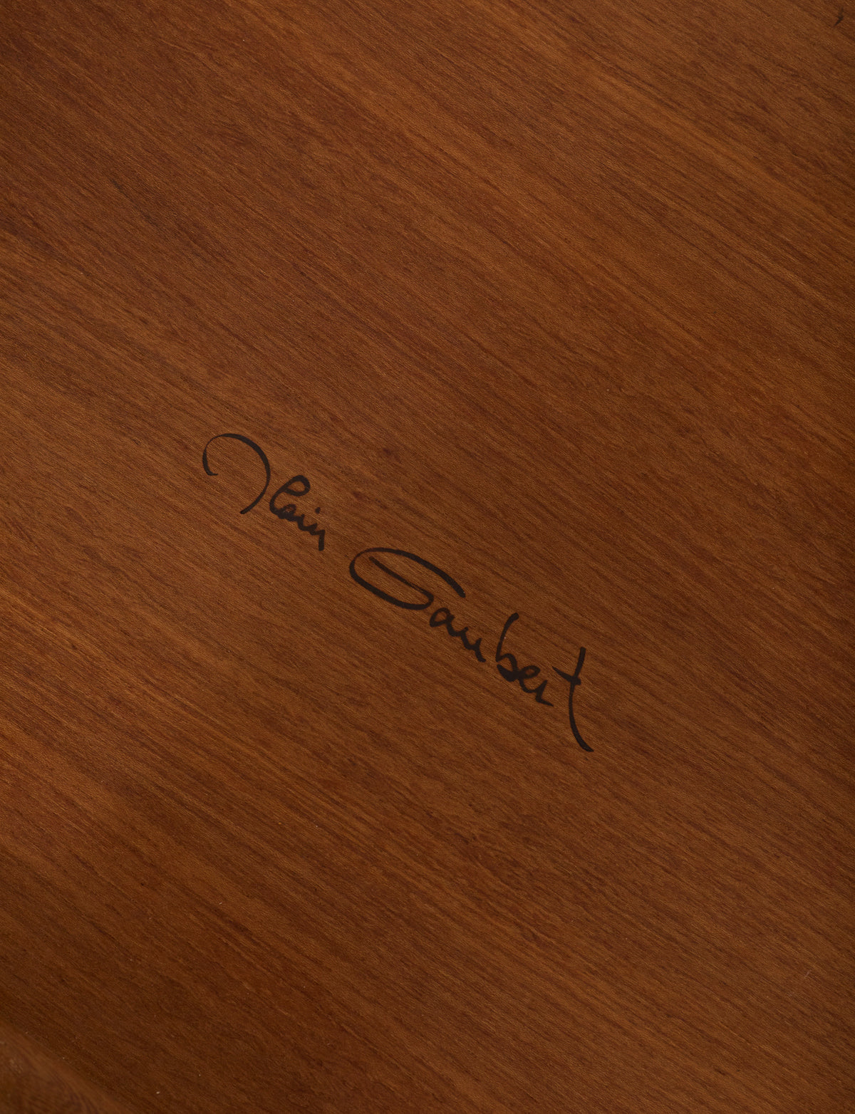 Small dismountable wooden meditation table by Alain Gaubert, France circa 1980 — close-up of signature on wooden surface
