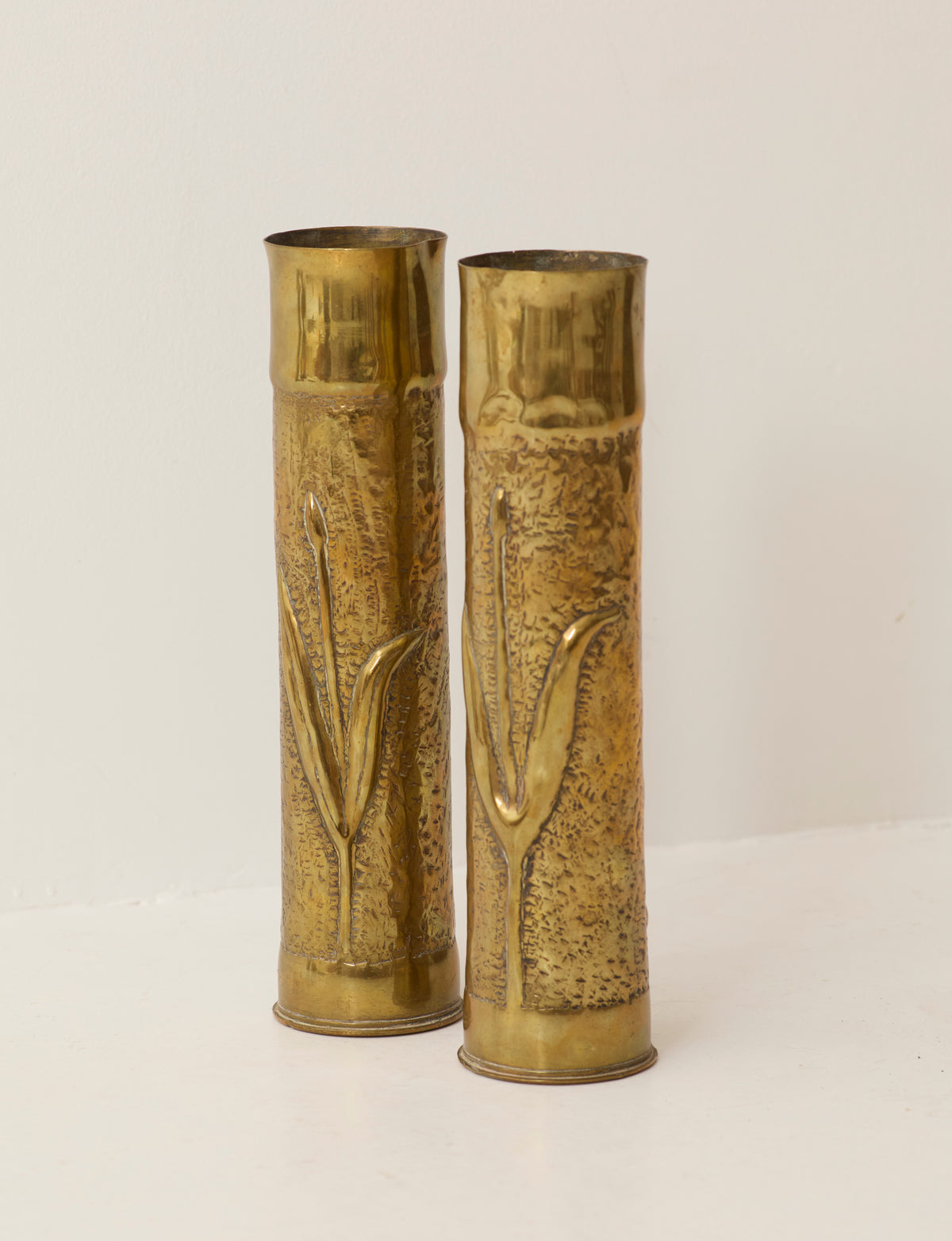Set of 2 Vintage Vases in Metal Brass — angled view highlighting embossed floral design