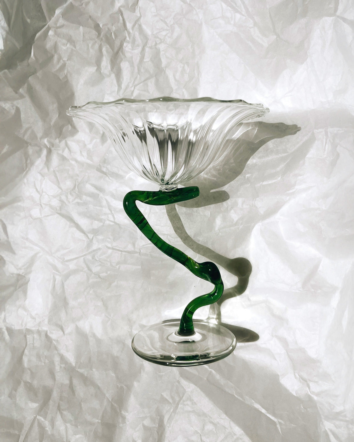 Crystal ice cup with green spiral vine stem on clear base