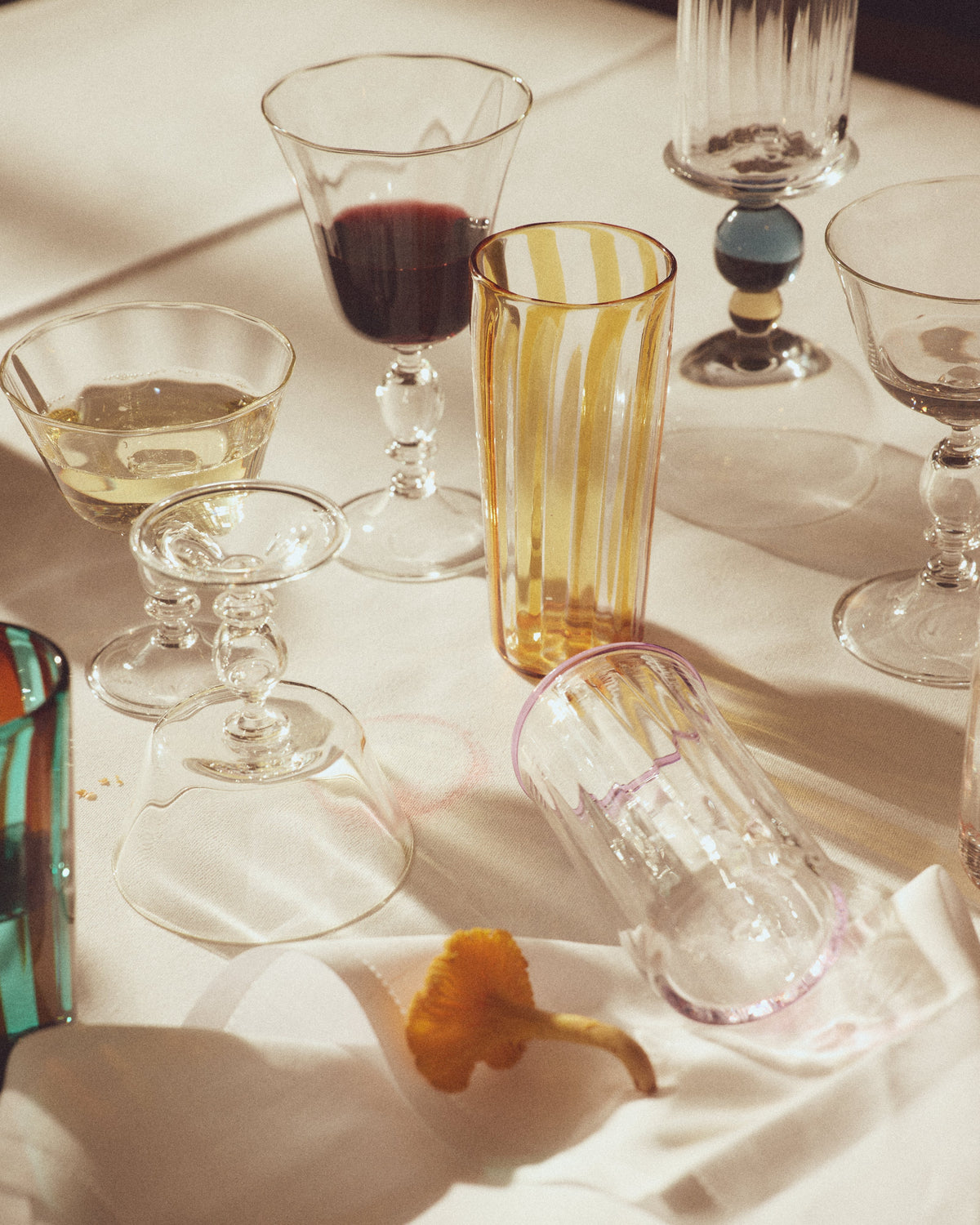 Alban Wine Glass - Set of Four — top view with colorful glassware on table