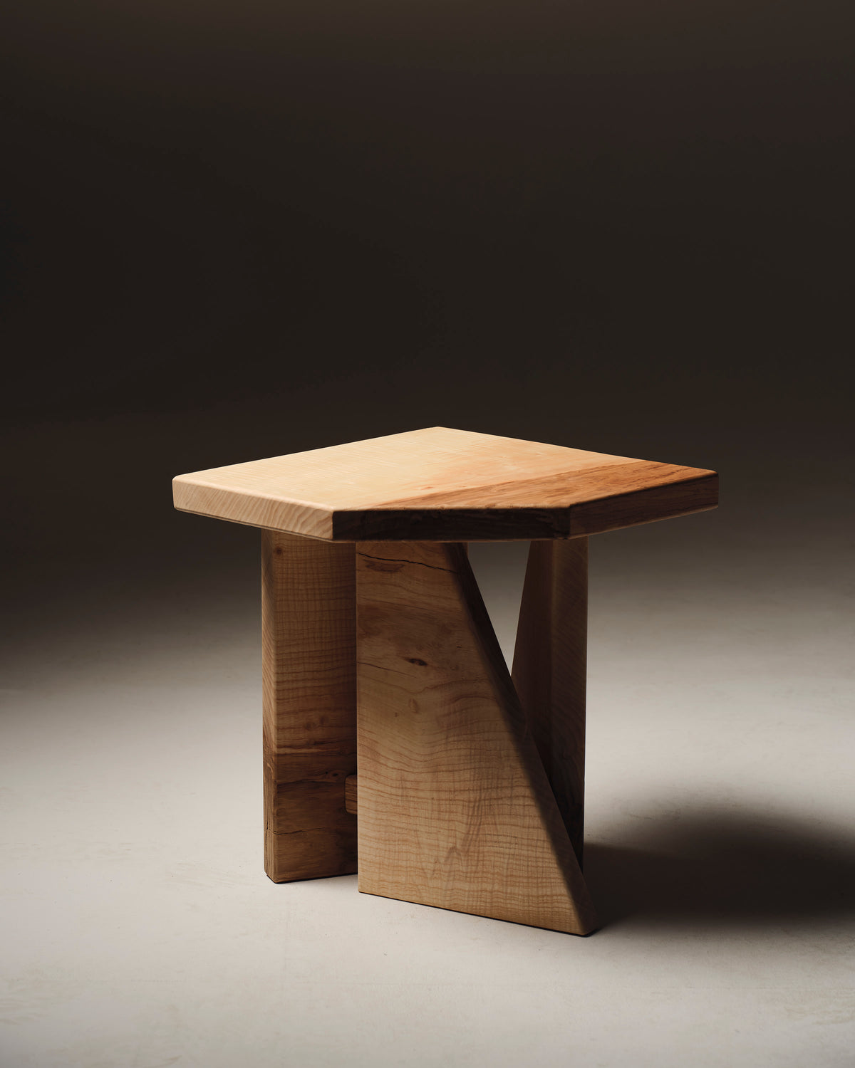 Maple wood stool side table with curved sculptural base