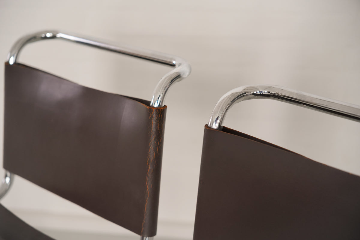 Close-up detail of B33 cantilever chair chrome frame and leather seat