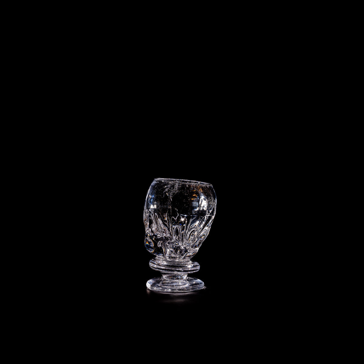 Round Free-shaped Glass — top view on black background