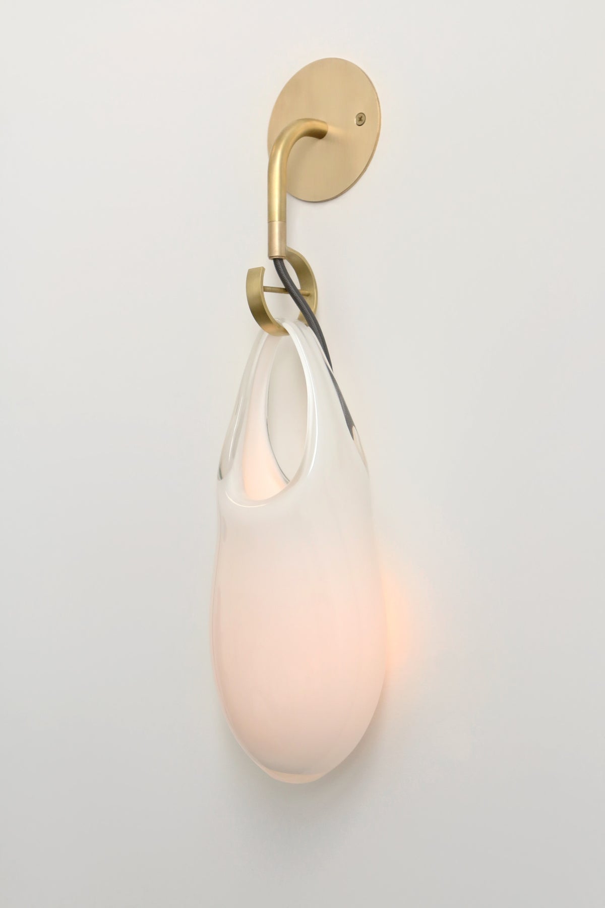 SkLO Hold 12 Sconce, White Glass, Brushed Brass, Black Cord — detail view