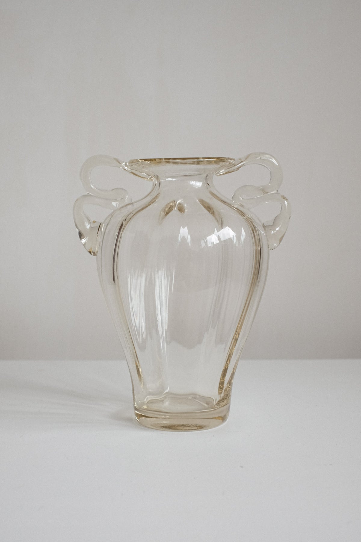 Elegant Handcrafted Glass Vase with Decorative Handles — close-up