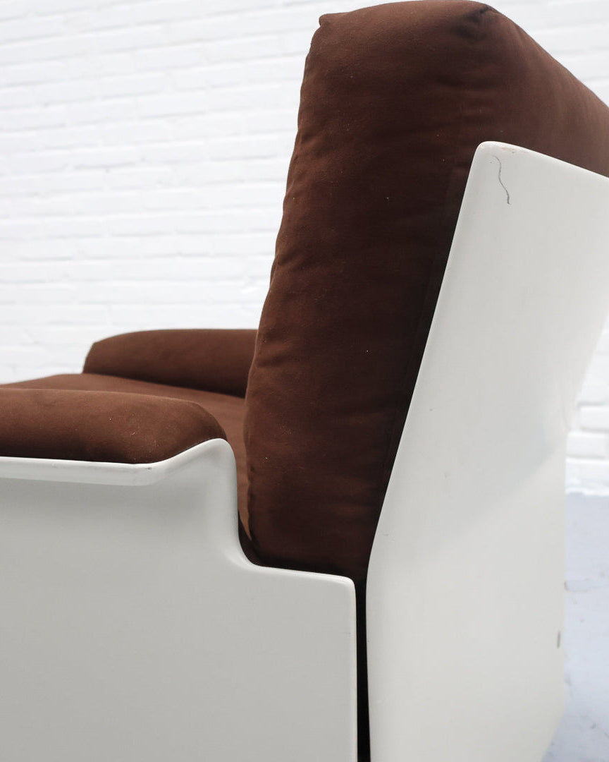 Brown cushioned Dieter Rams 620 armchair detail showing white frame