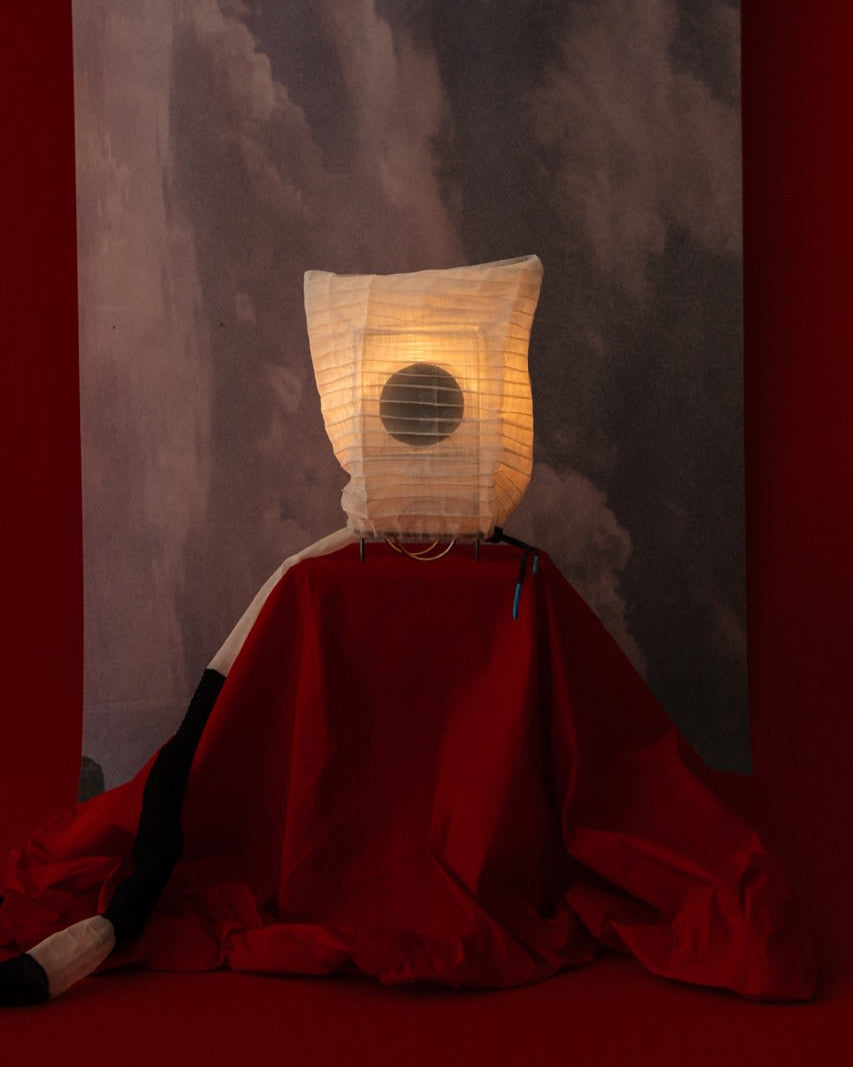 Majo table lamp with illuminated paper shade and red fabric base