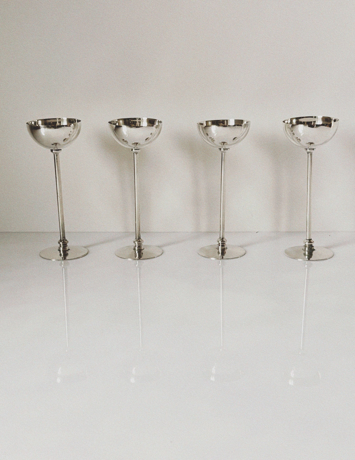 Four vintage silver plated champagne coupes on stems, Poland 1970s