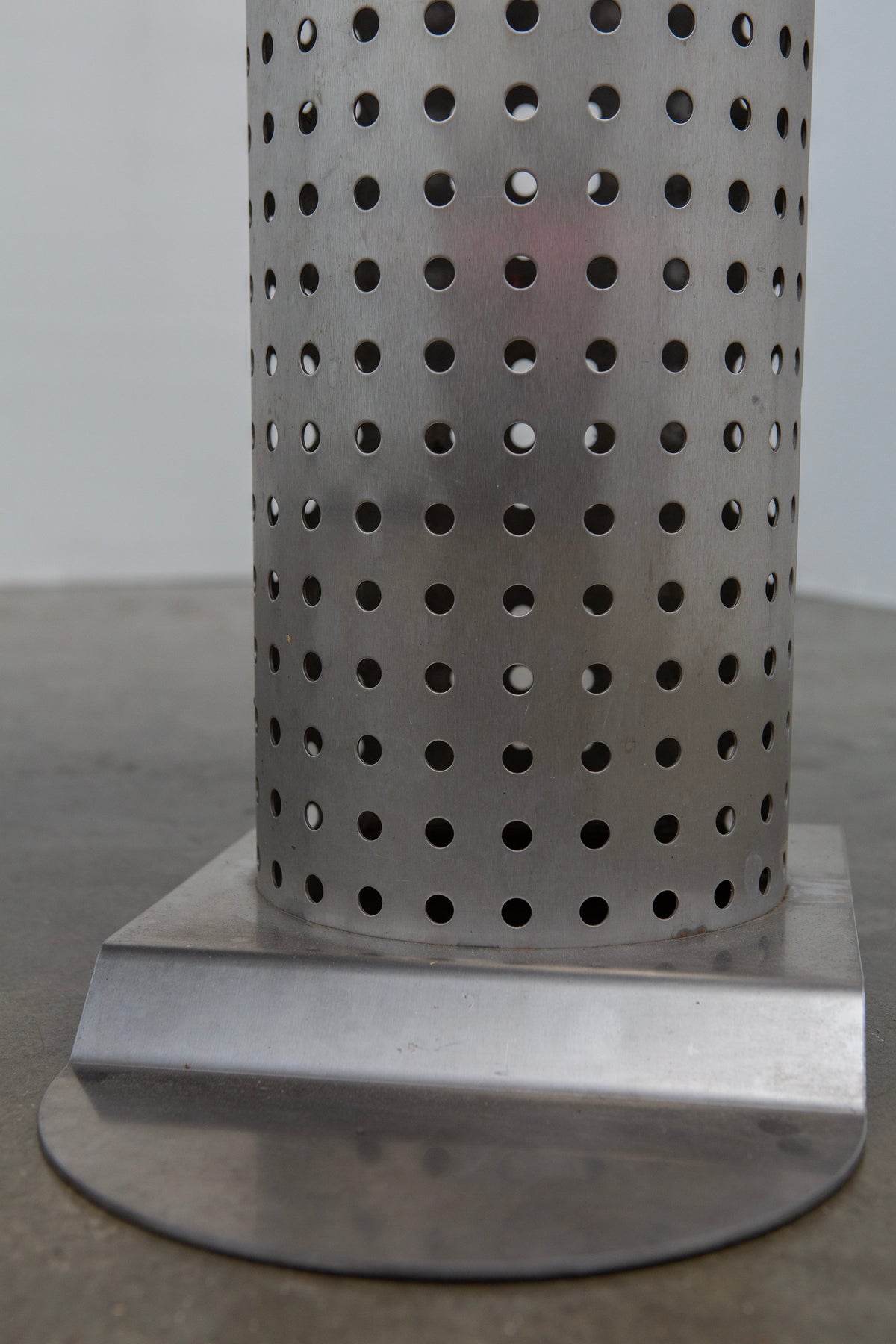 Postmodern Stainless Steel Dining Table, c.1980 — close-up of perforated stainless steel base