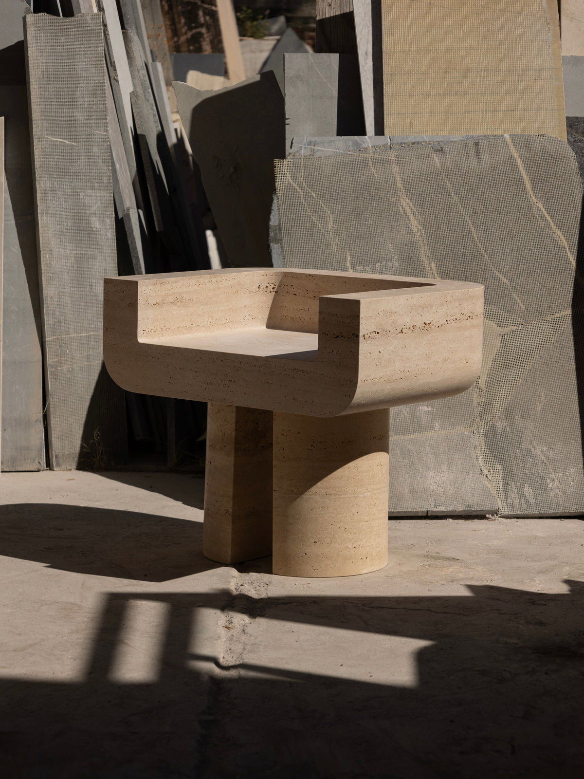M_001 Chair — modern stone chair in industrial setting