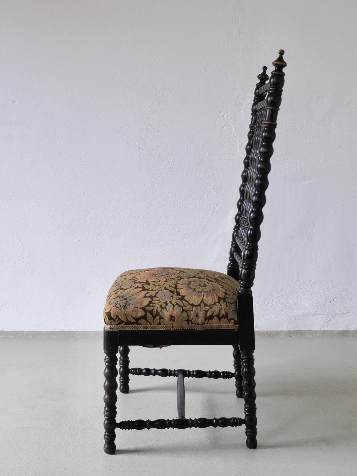 Ornate French oak bobbin chair with floral tapestry seat from 1850s