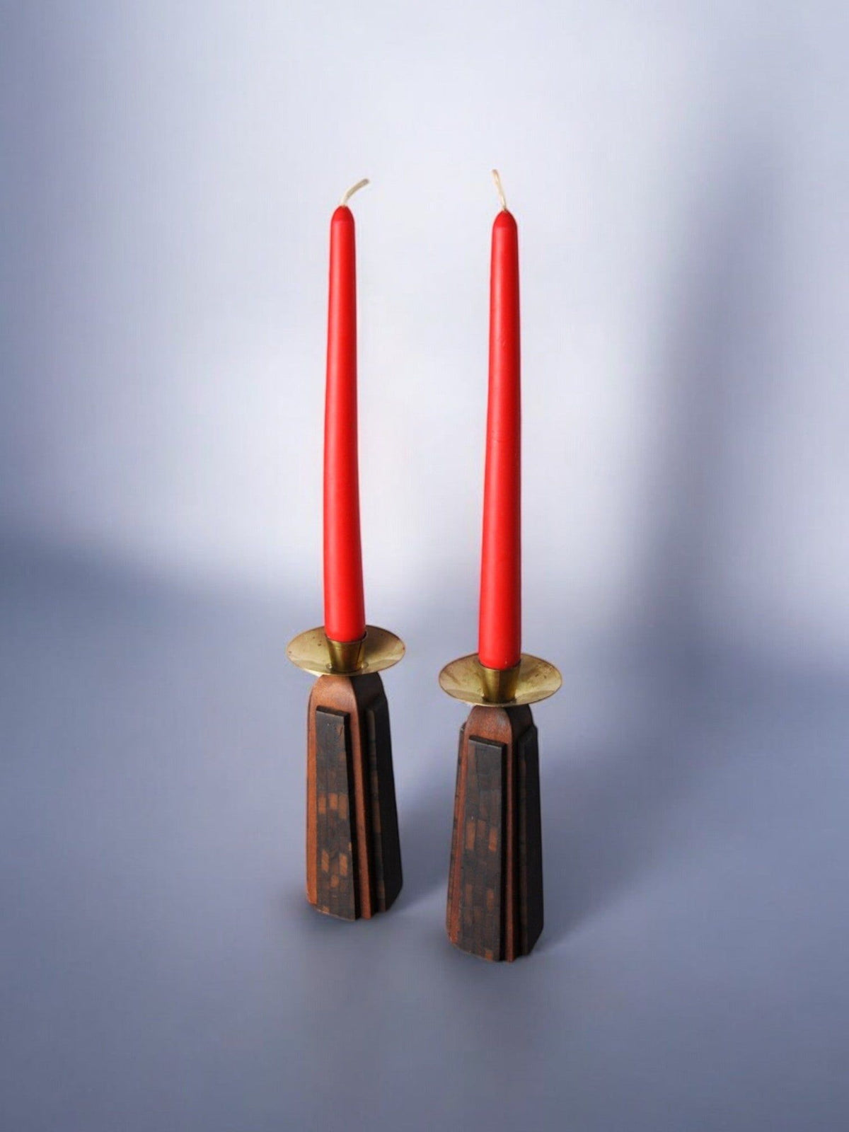Pair of "David" Candle Holders 1960 — angled view with red candles