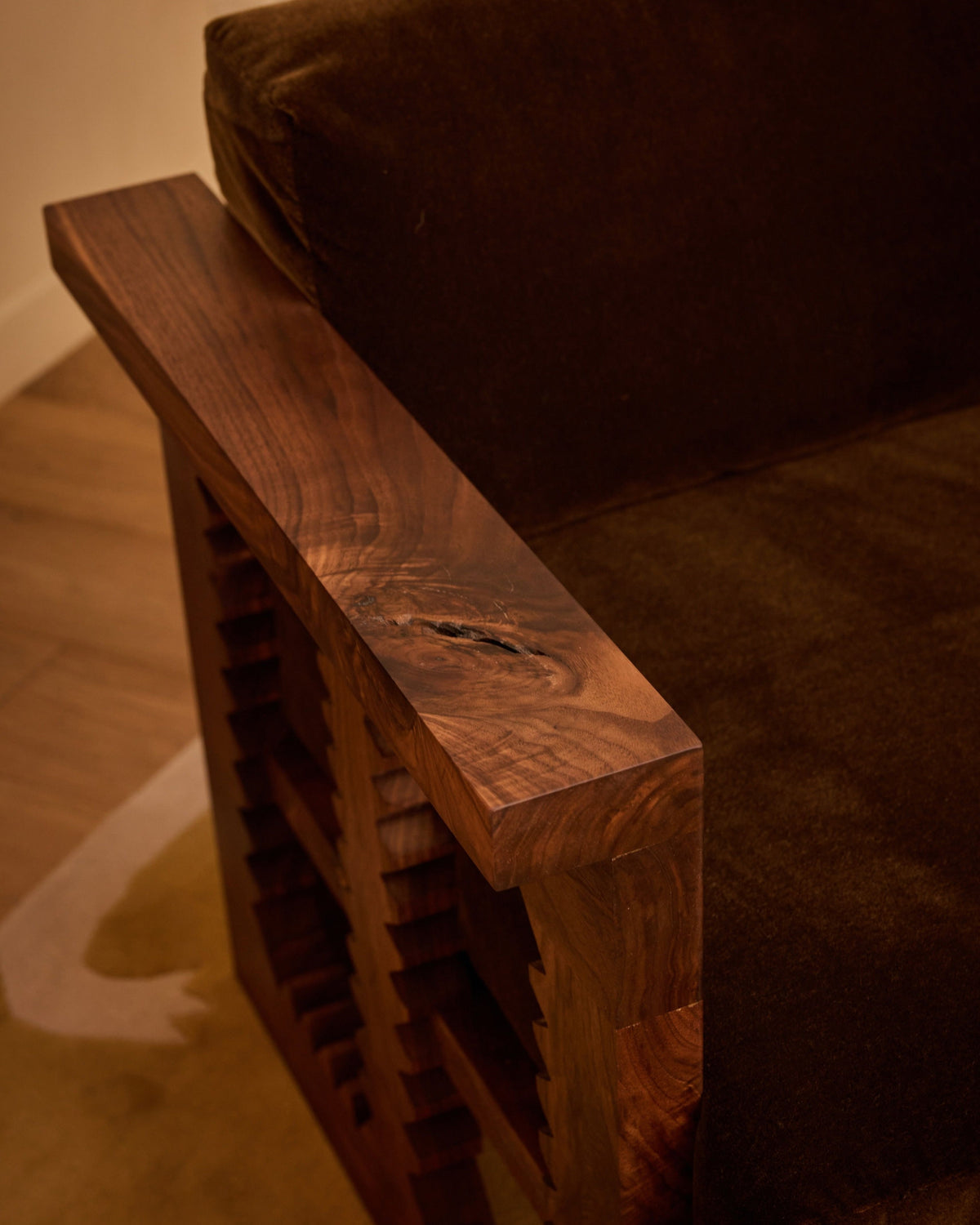 Jura armchair walnut wood armrest detail with wine storage