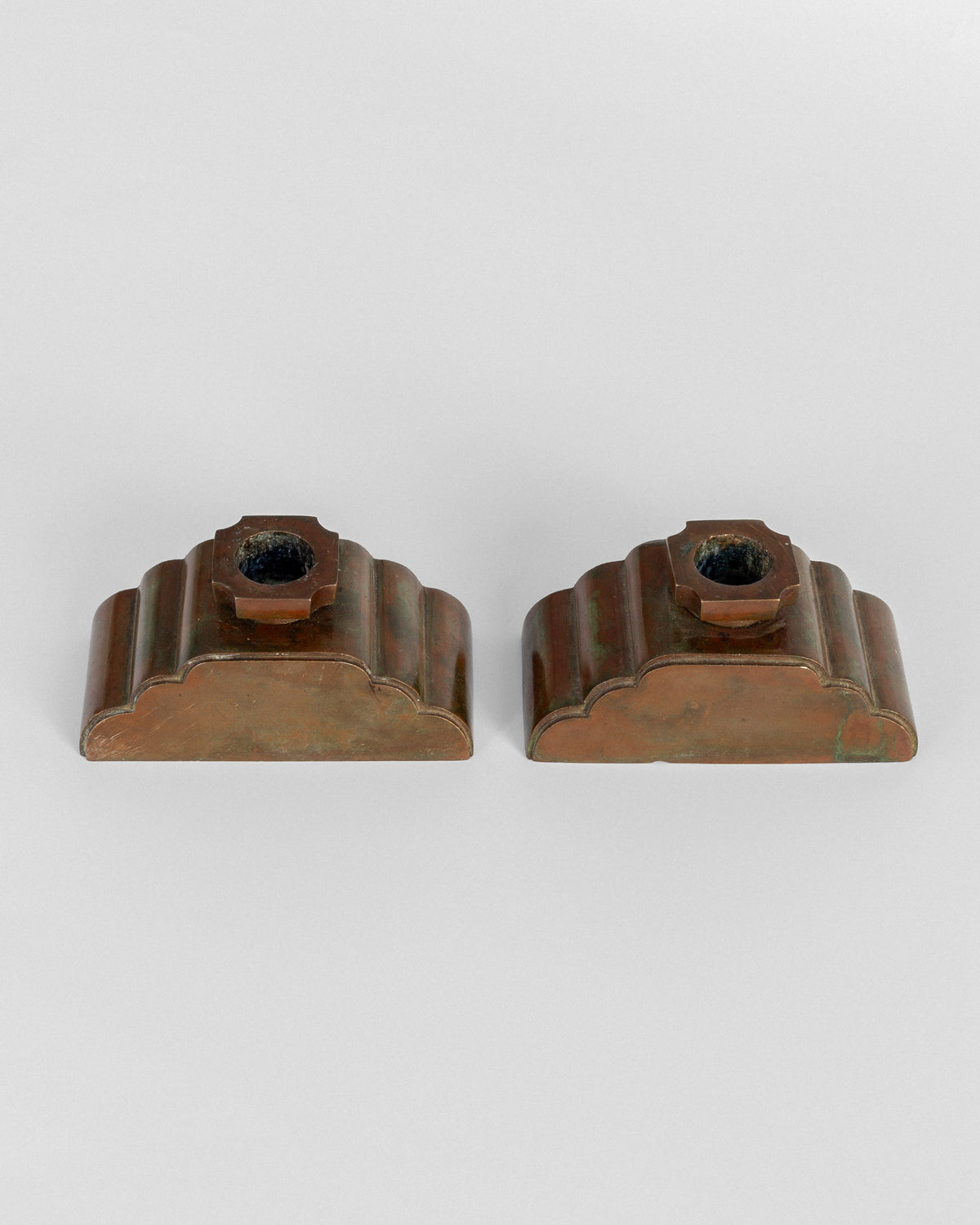 Pair of bronze candleholders front view by Sune Bäckström 1930s