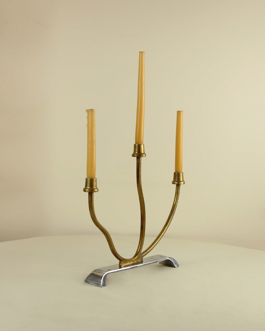 Brutalist Candleholder — top view of brass and aluminum design