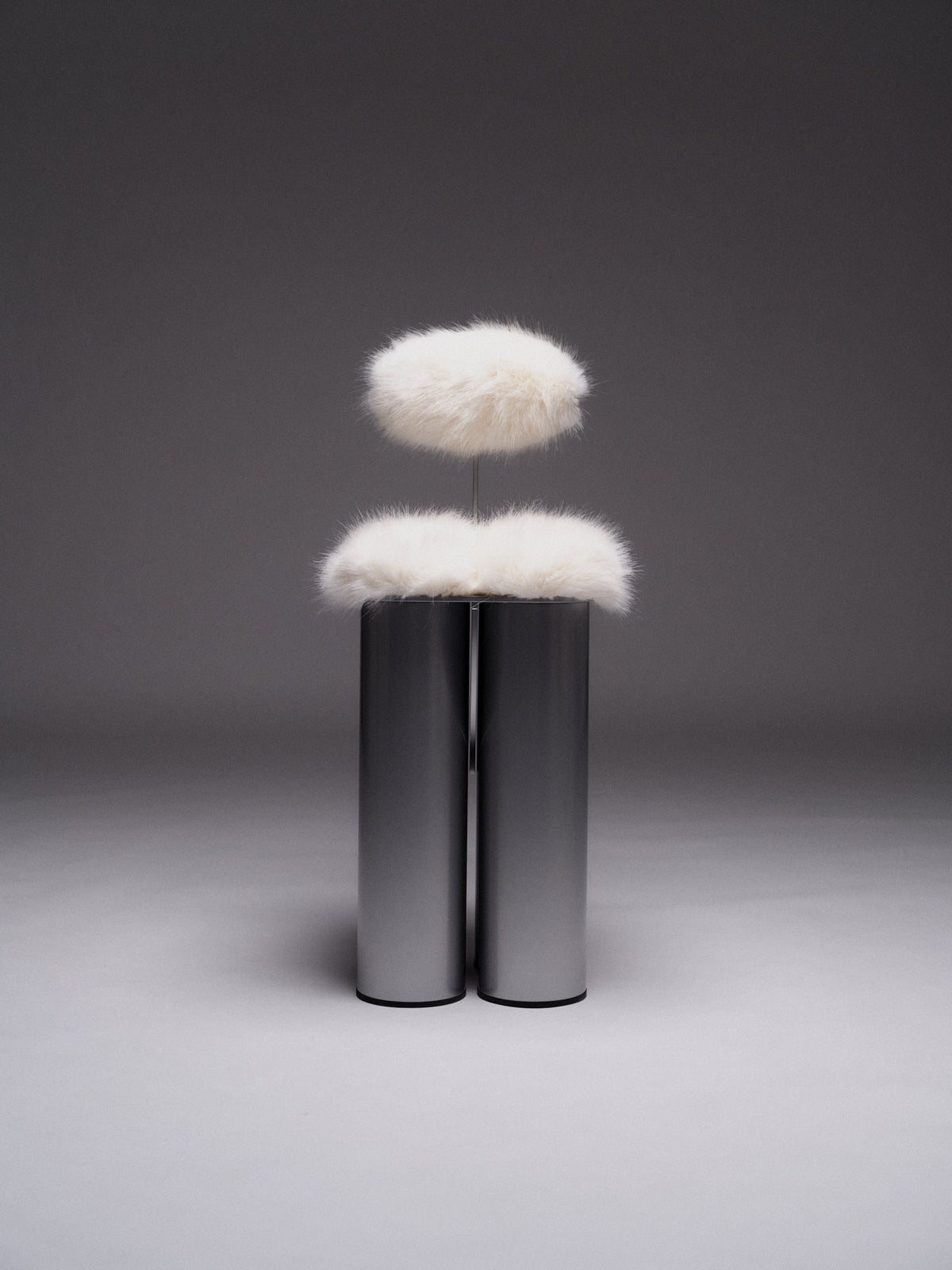 Giulio Stool — back view with white fur and metallic base
