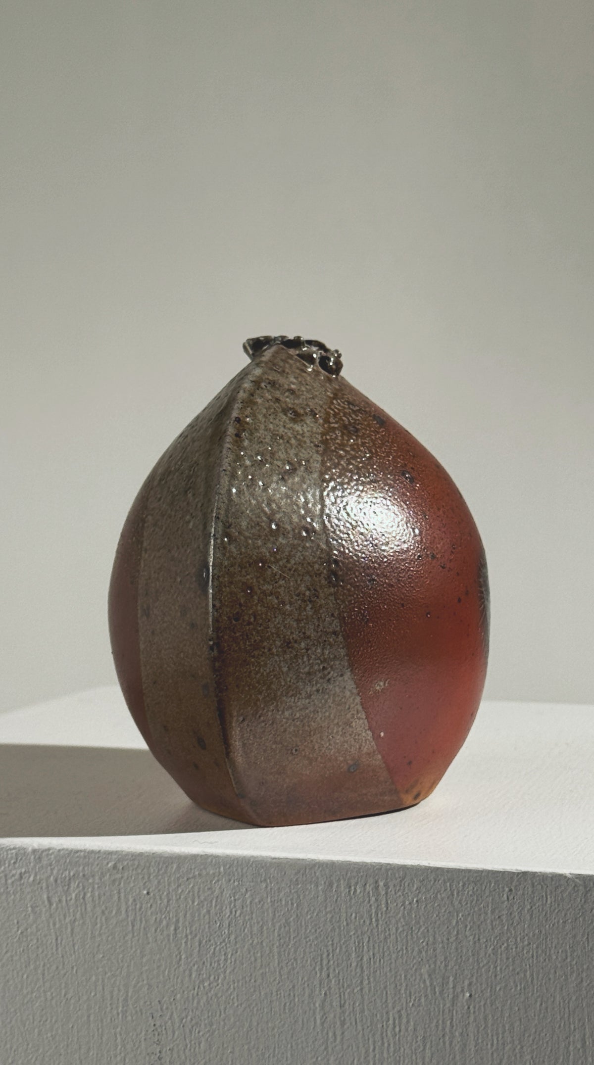 Brown stoneware soliflore vase by Gustave Tiffoche showing glazed finish