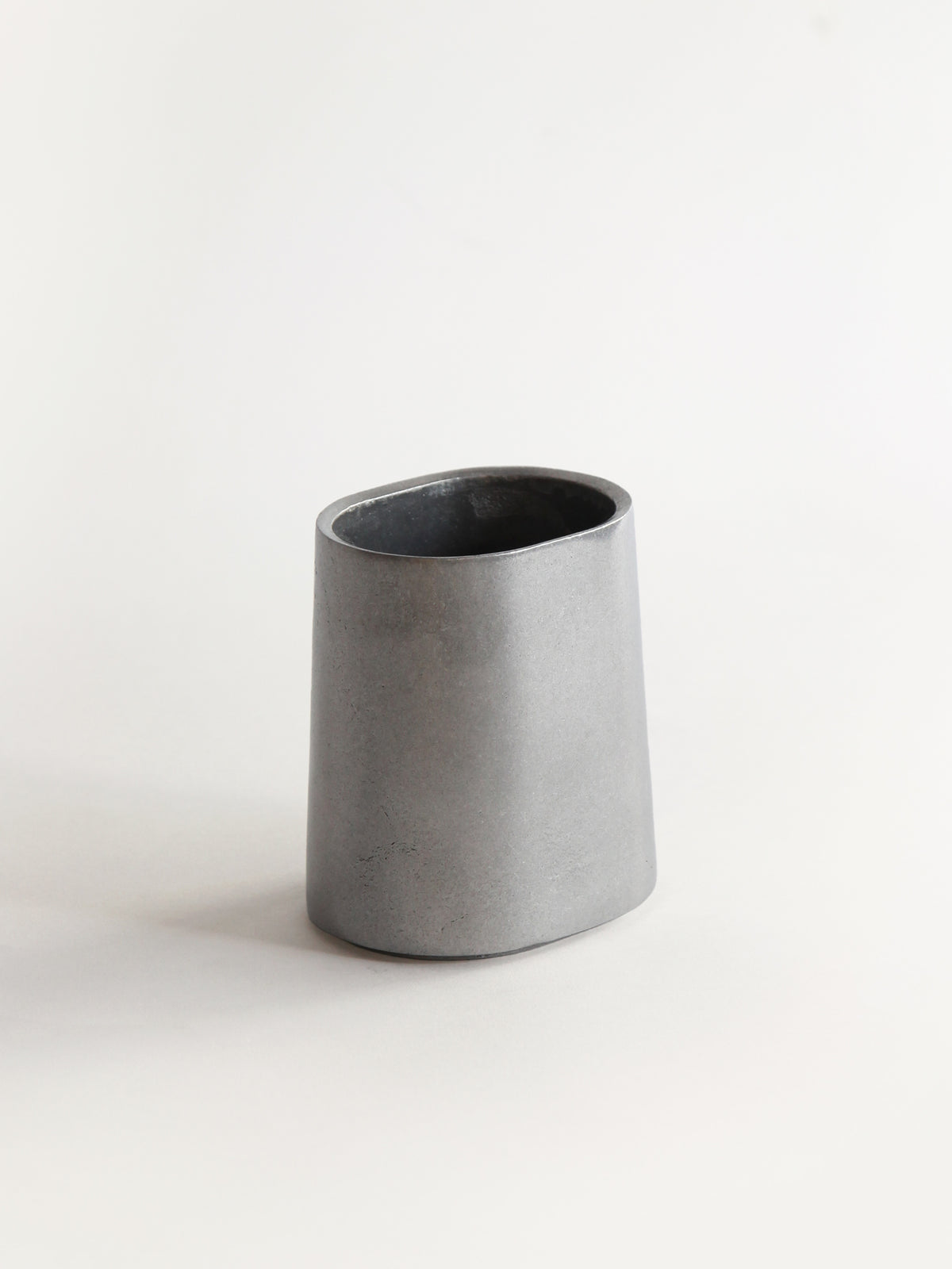 Taper Pen Stand — angled view of gray concrete material