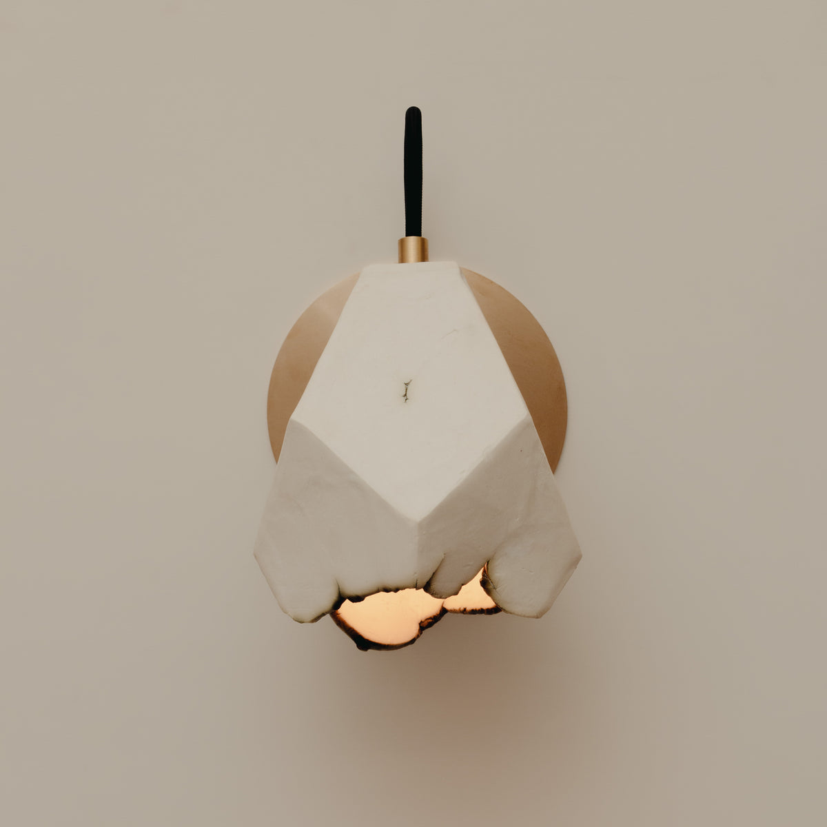 Relic Spotlight Sconce — close-up of white plaster and brass details