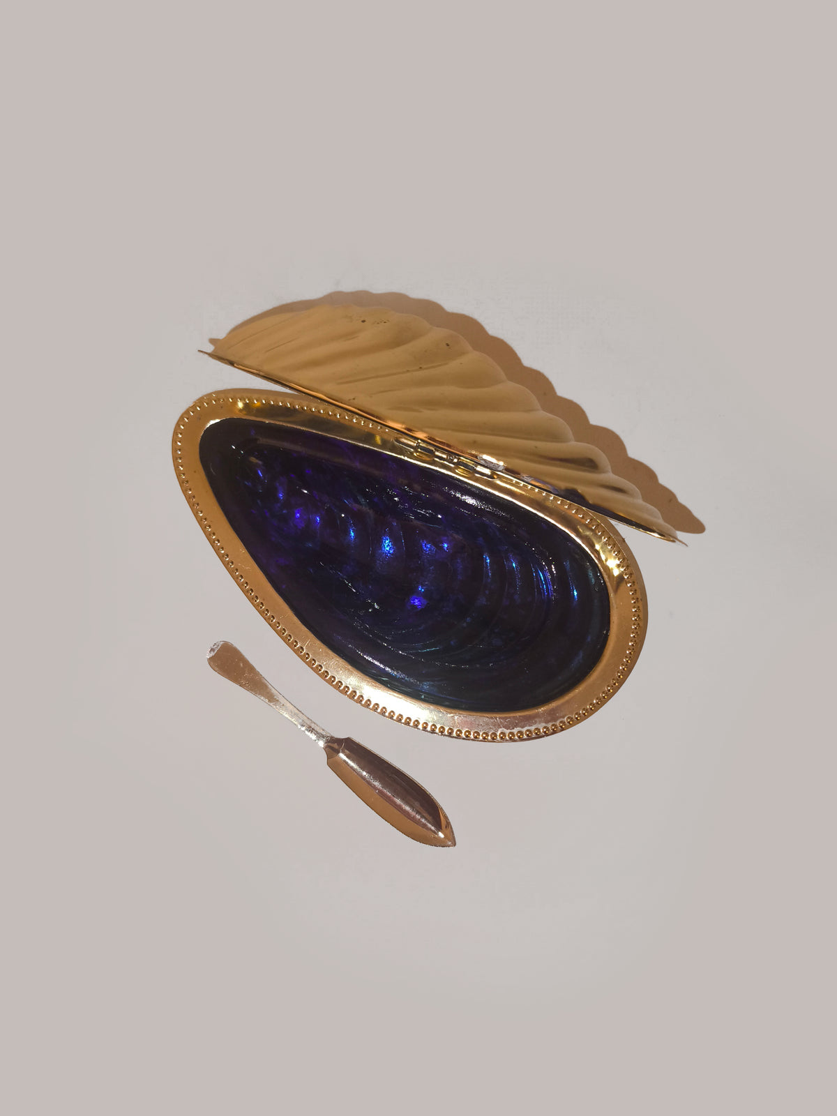 Shell Butter Dish — close-up of gold and purple shell design